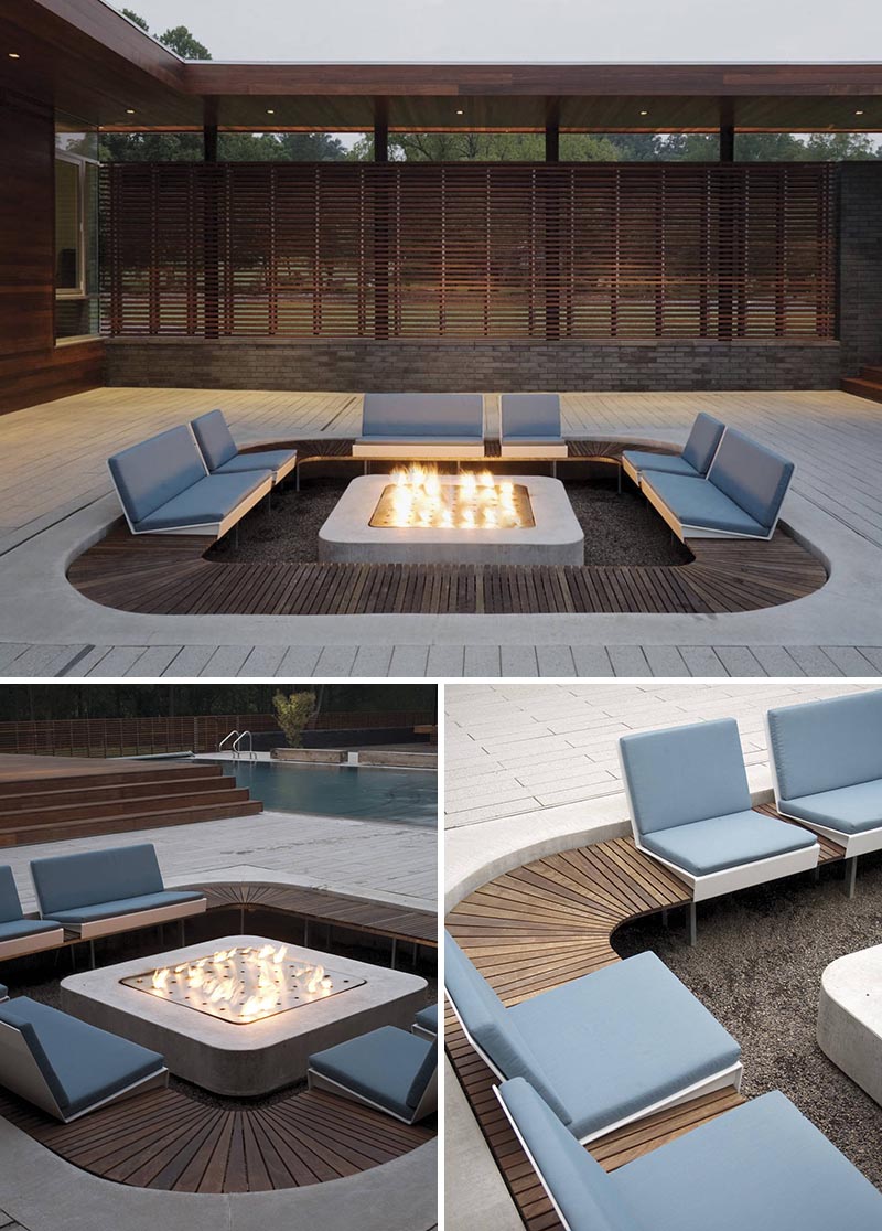 A modern outdoor conversation pit with custom seating that's focused on the fire.