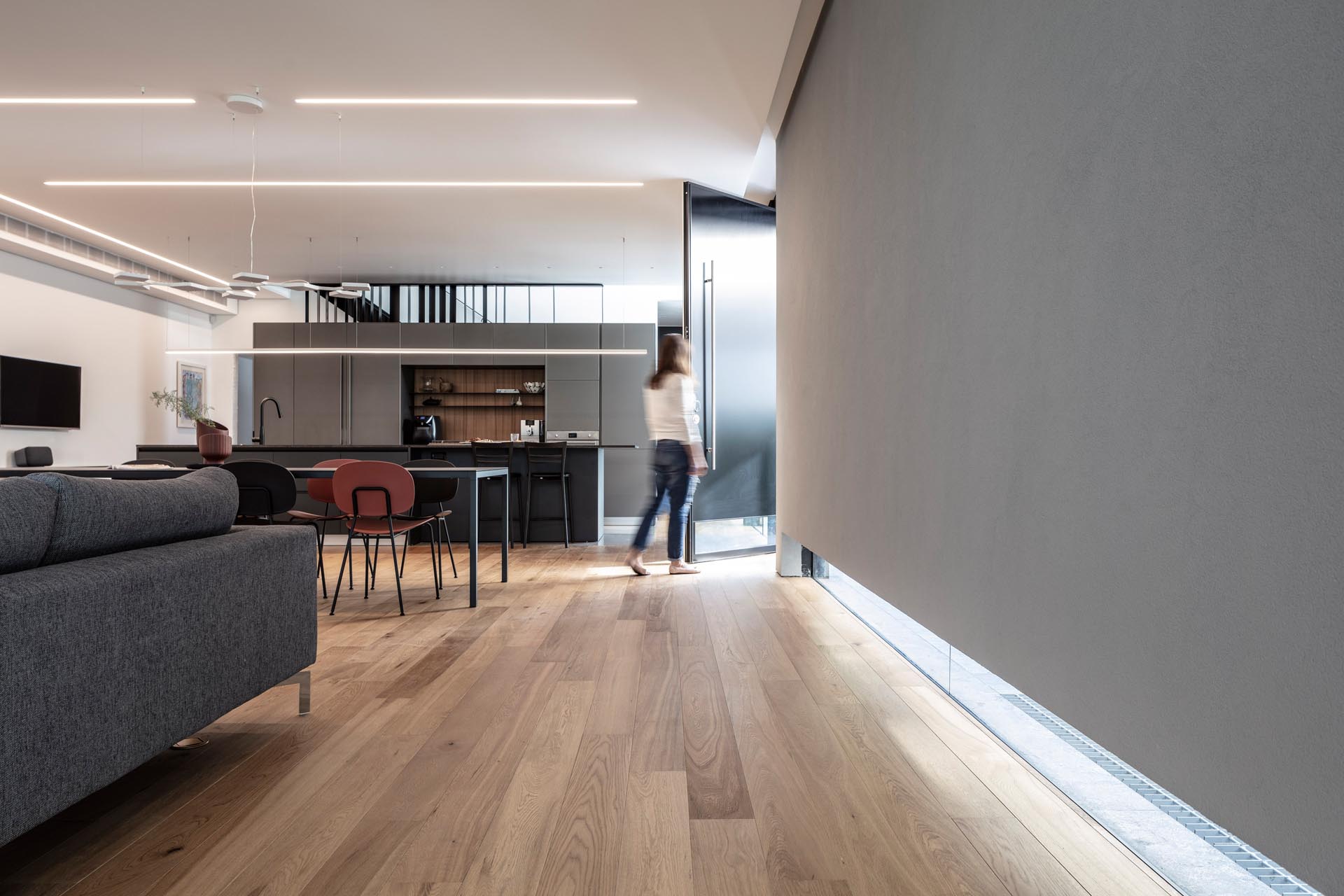 A low window is included in the front wall and front door of this modern house.