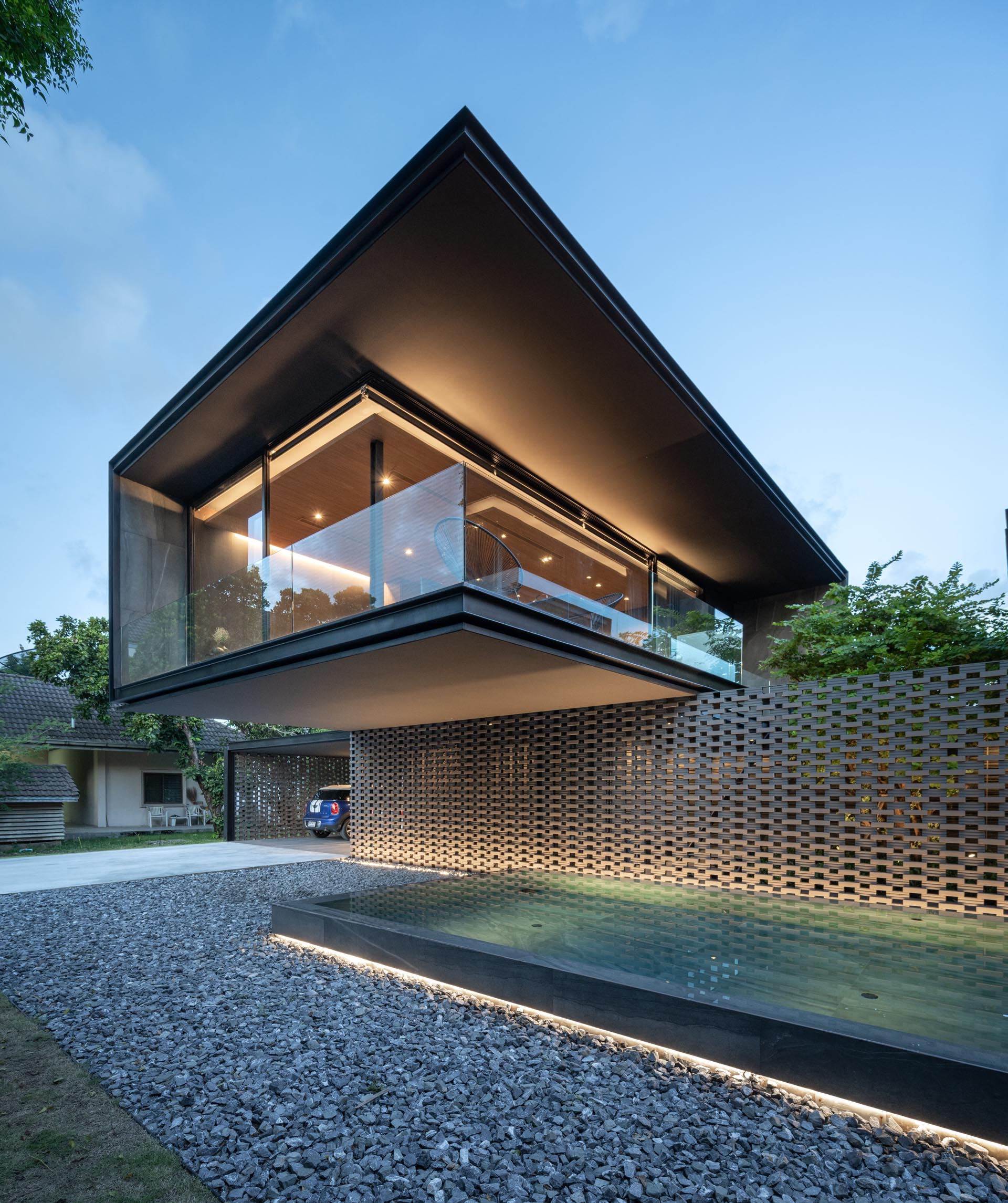 Lighting has been used to highlight the horizontal lights of this house design.