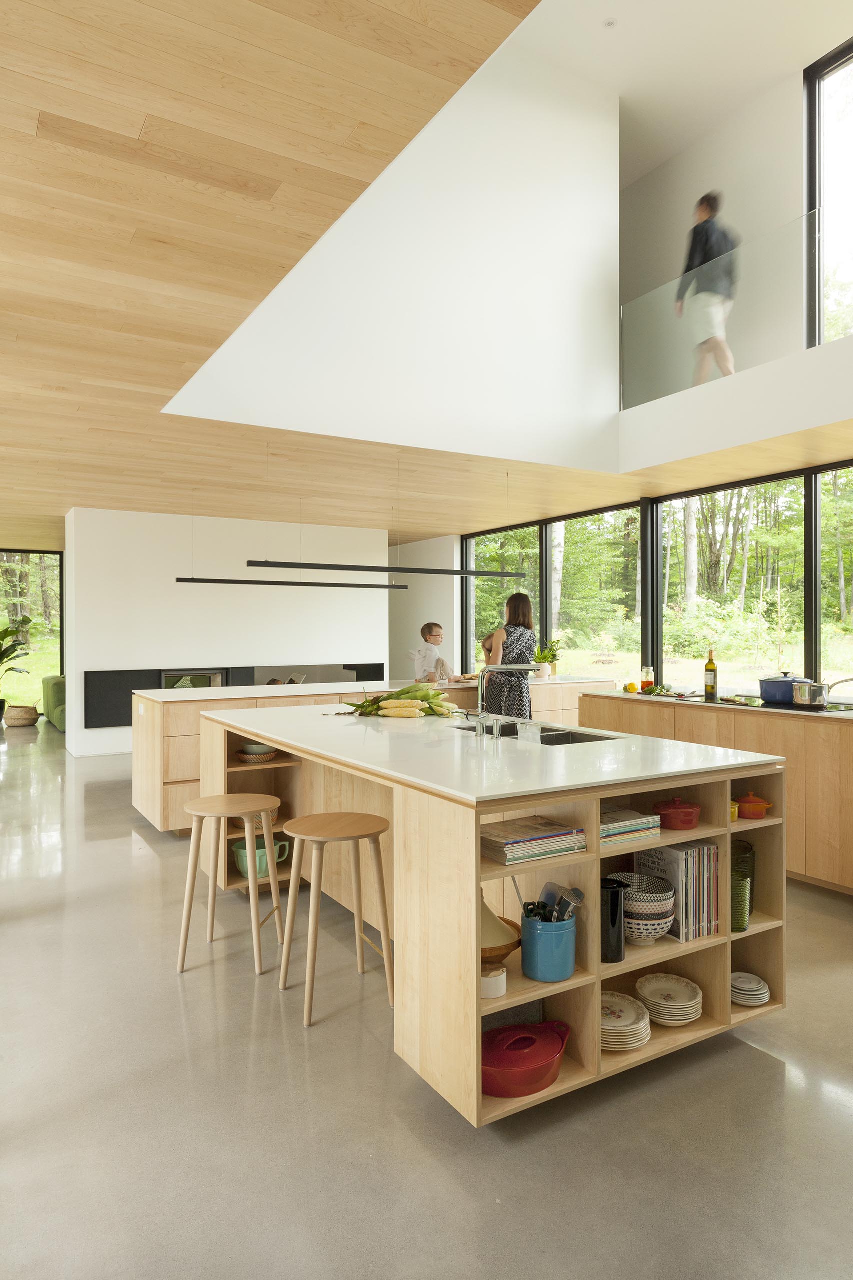 A modern kitchen with three islands that provide plenty of storage.