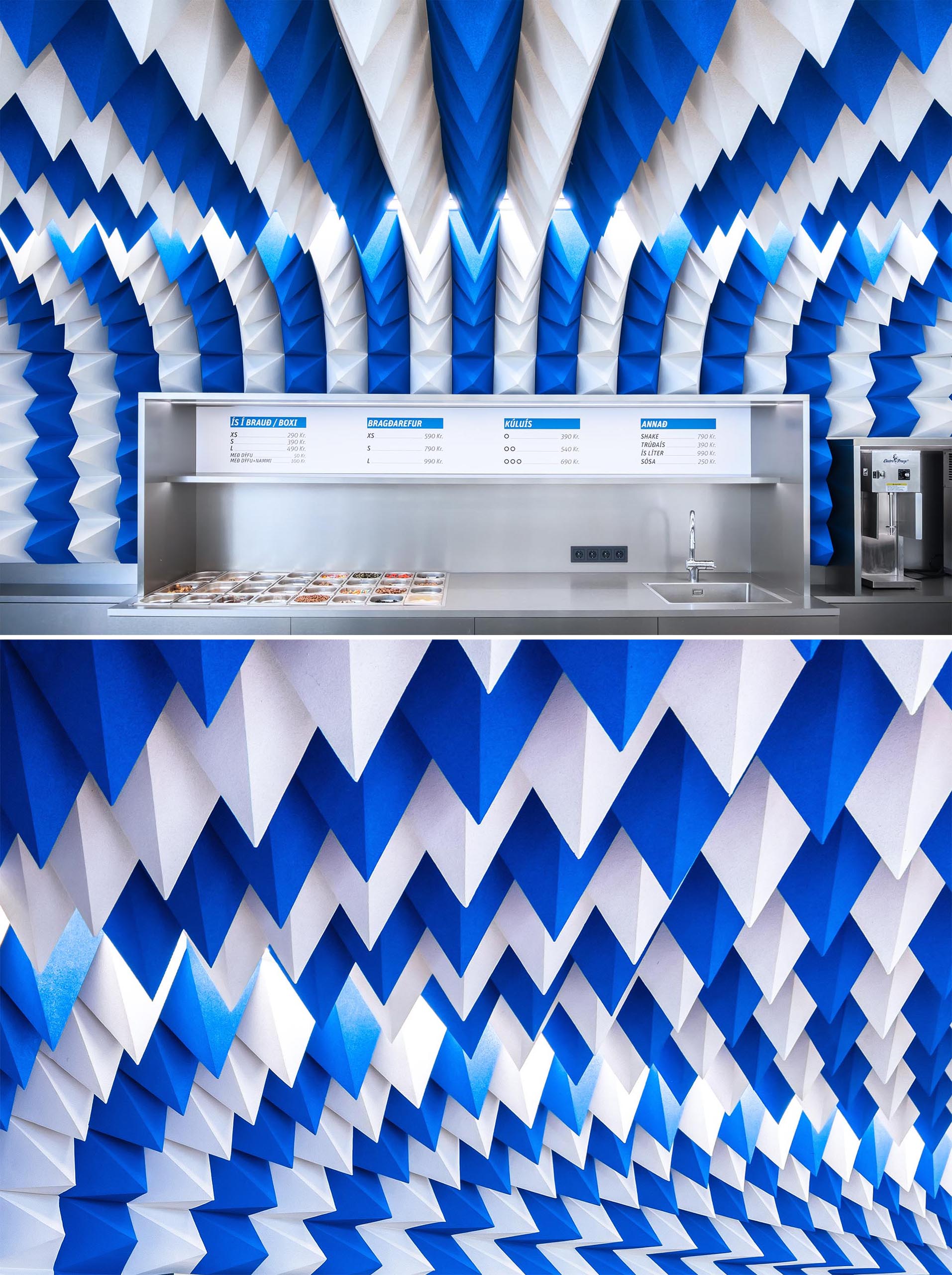 A modern ice cream store with a sculptural ceiling installation made from blue and white foam pyramids.