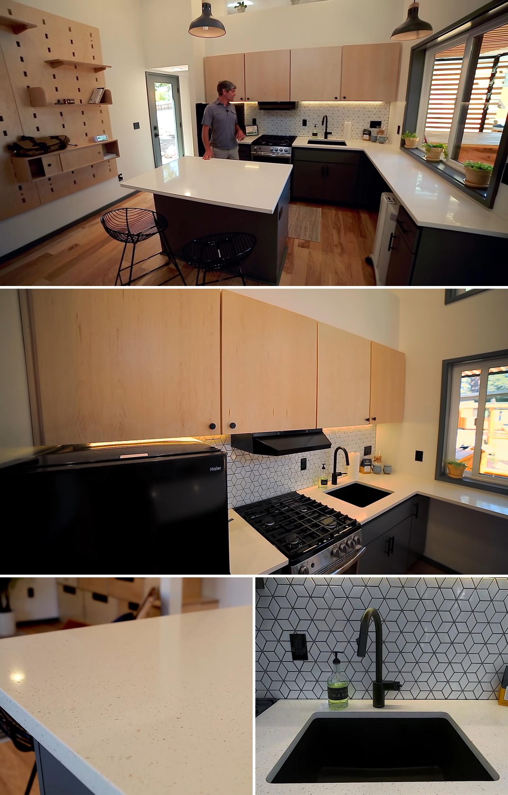 A tiny house kitchen with quartz countertops, 24 inch appliances, counter space, and a large black sink.