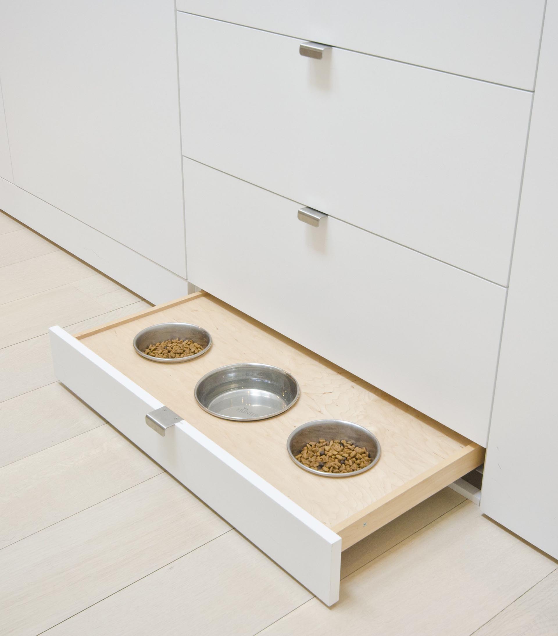 Hidden pet foot bowls located in a pullout drawer makes it easy to hide when not in use.