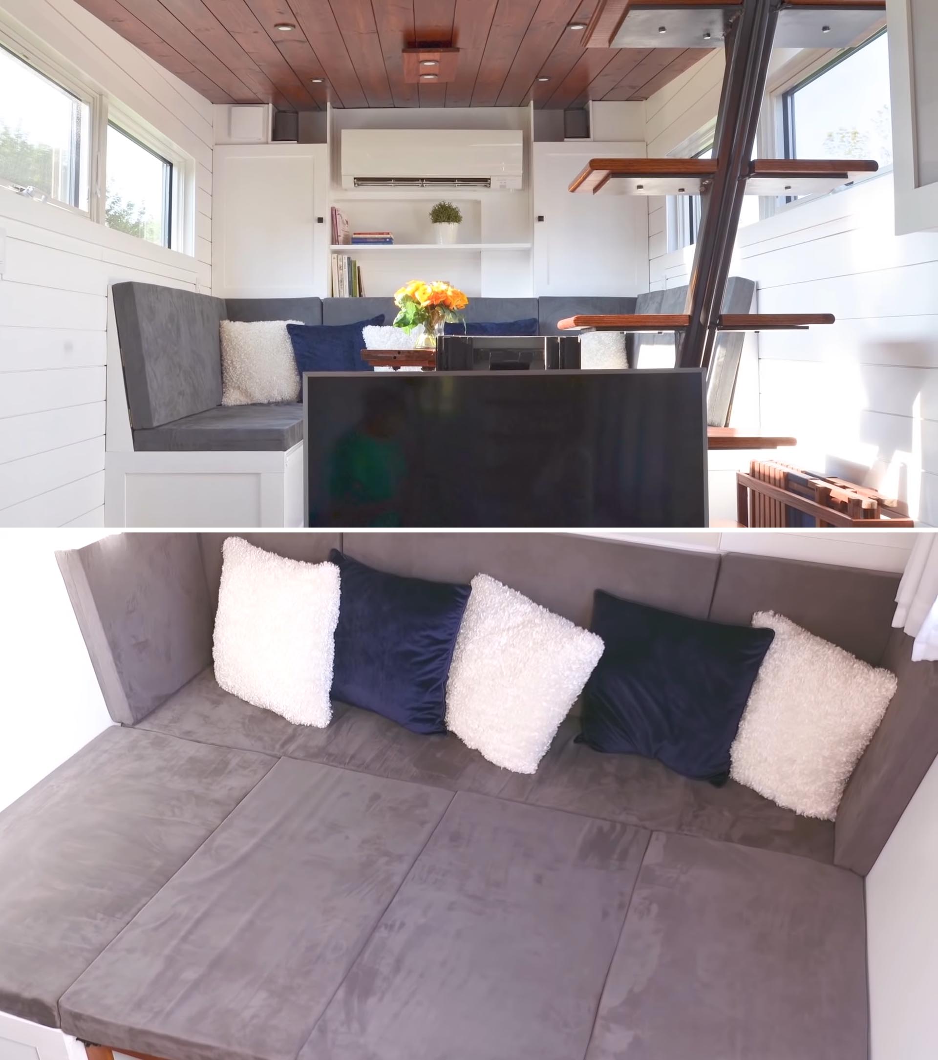 A tiny house living room with a couch that transforms into a queen sized bed.