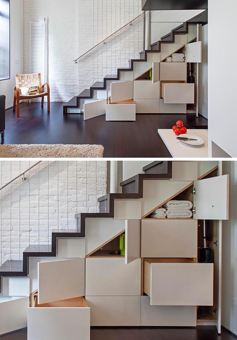 Built-in cabinets and drawers under these stairs add much needed storage to a small apartment.