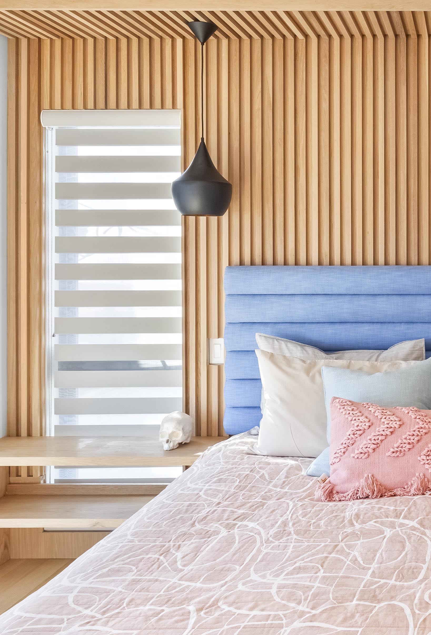 A wood accent wall with vertical slats.