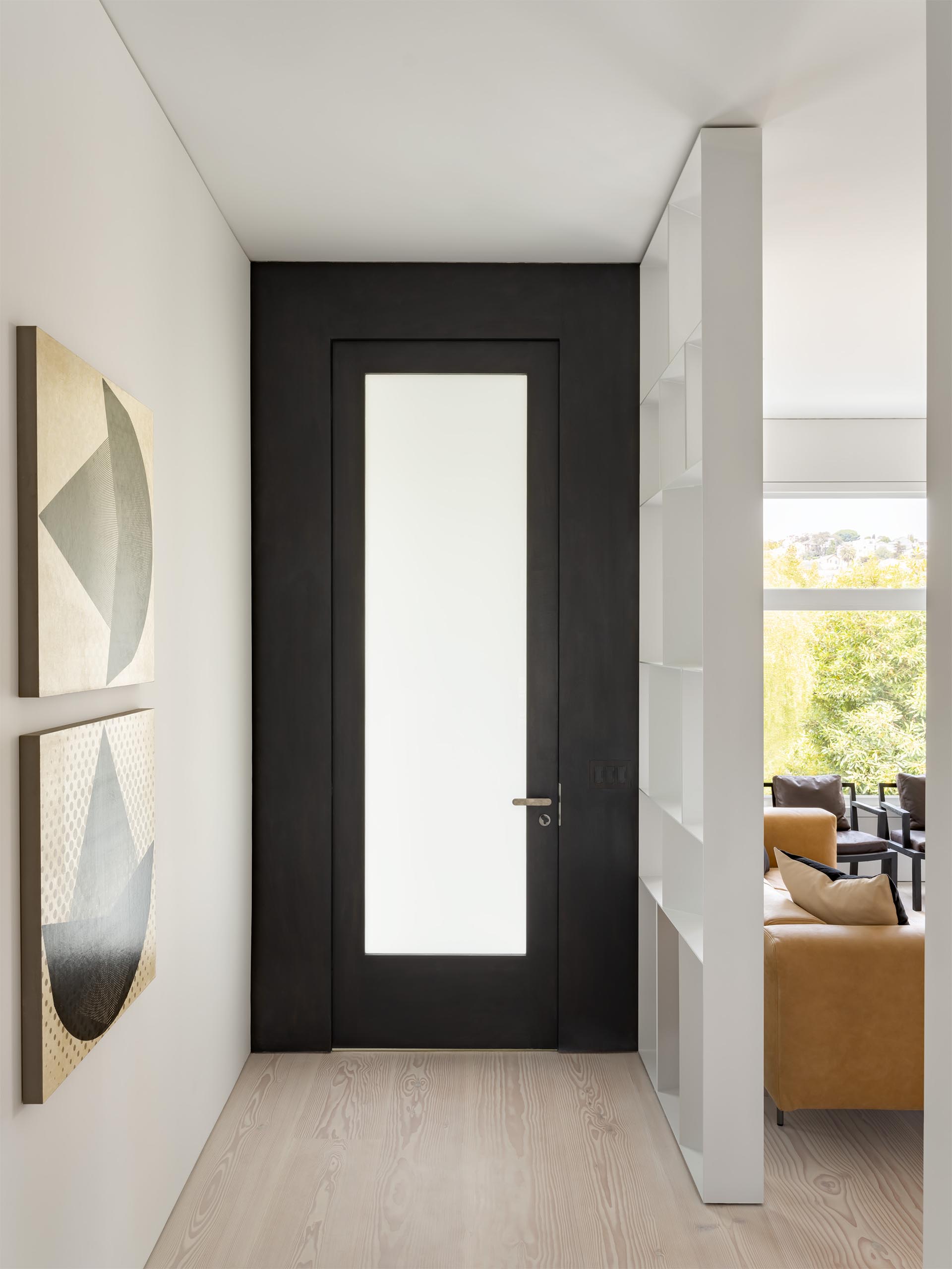 A black framed front door.