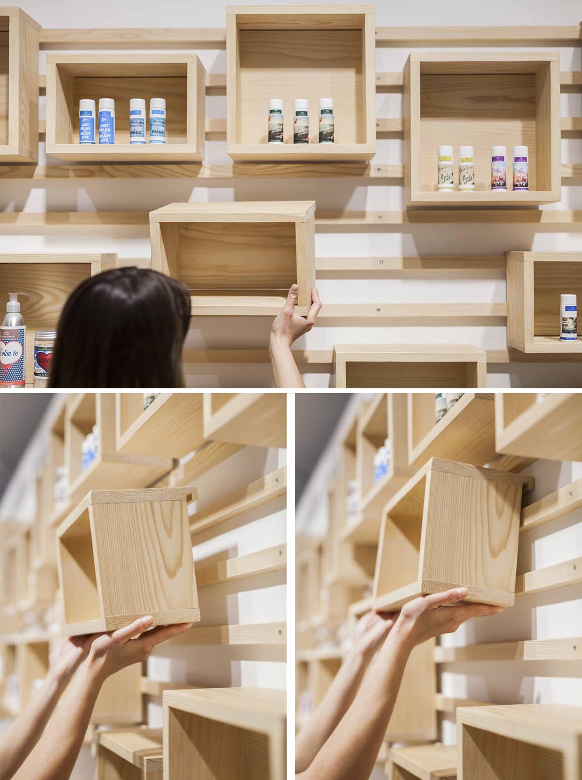 A wall-mounted cleat shelving system with wood boxes.