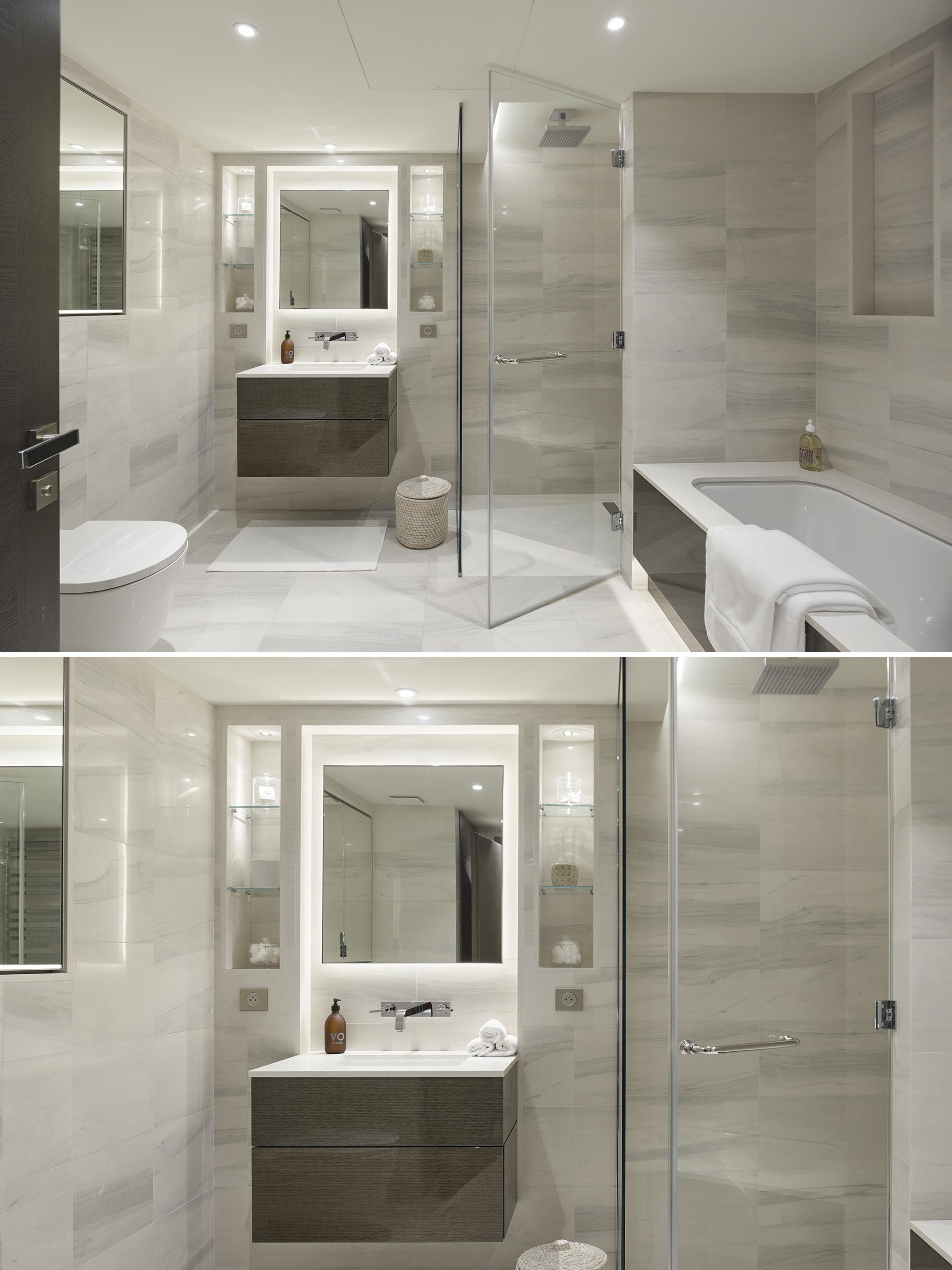 Neutral bathroom with glass enclosed shower and backlit mirror.