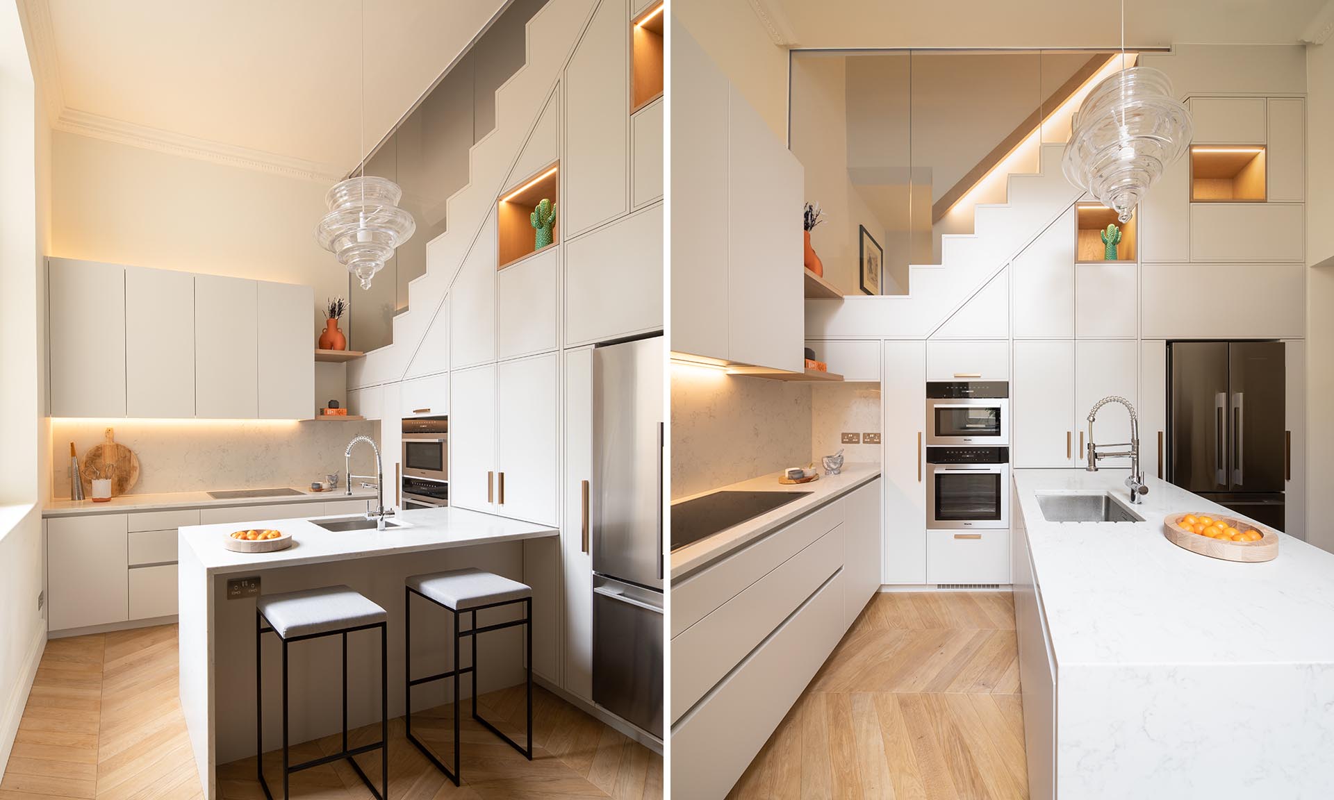 A modern white kitchen with white countertops, LED lighting, and plenty of storage.