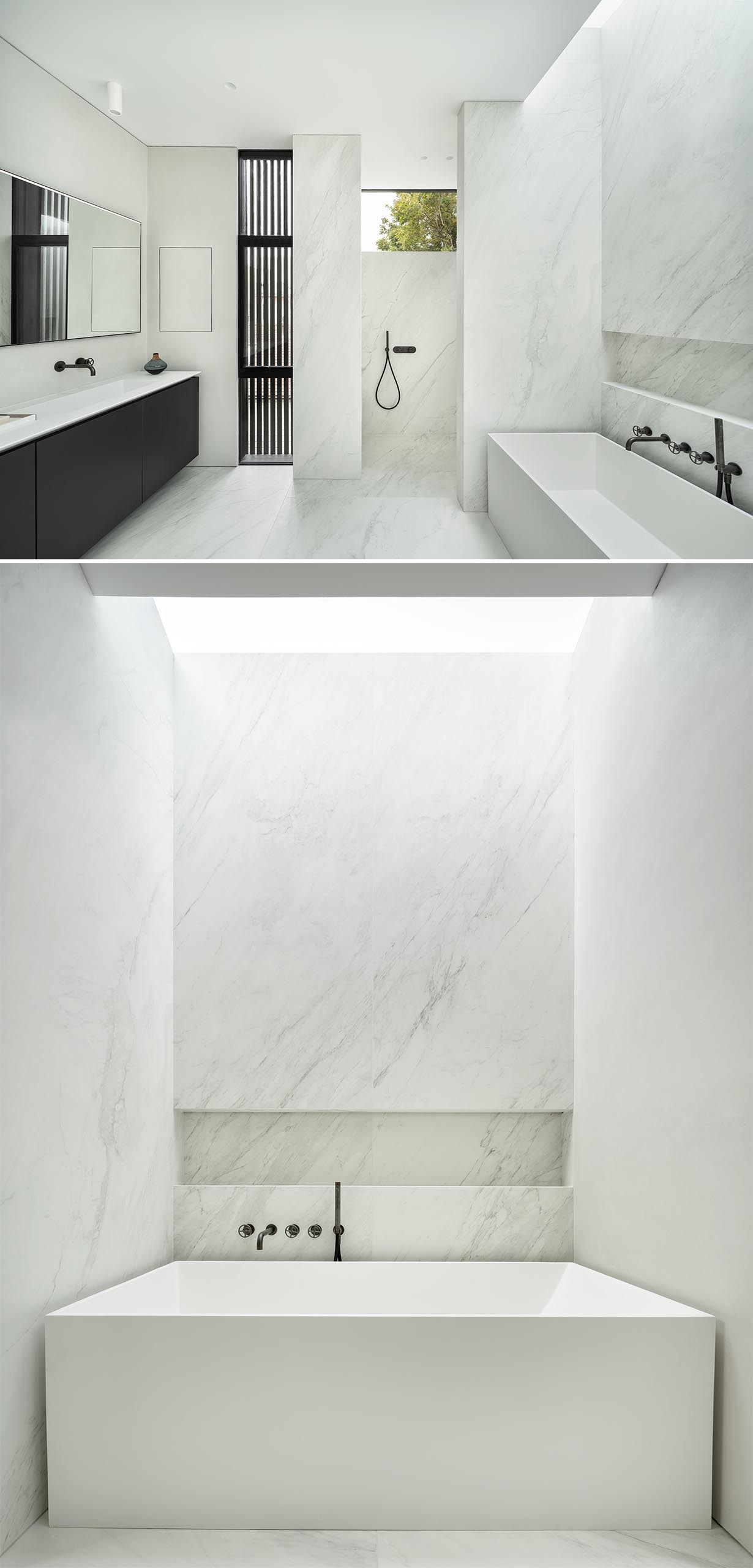 A white bathroom with a shelving niche and a skylight.