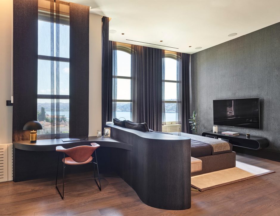 The Headboard Transitions Into A Desk To Create A Small Home Office In