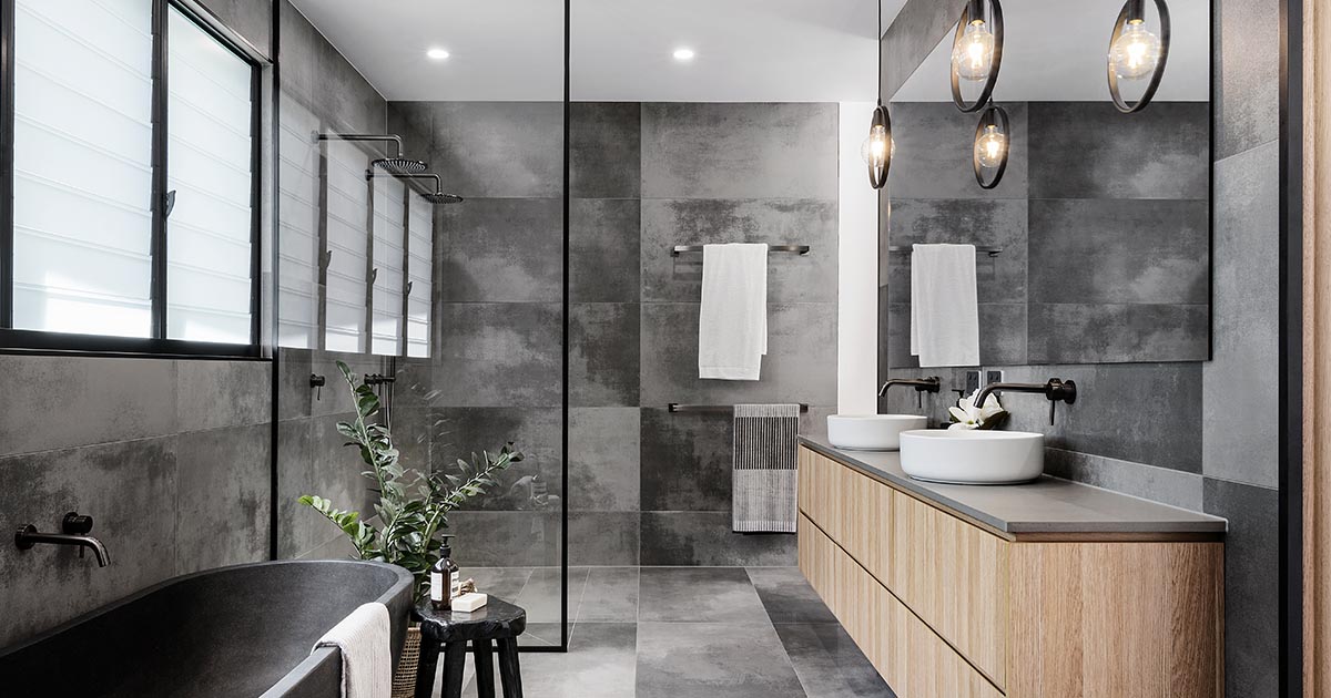 A Cloudy Grey Tile Sets The Palette For This Bathroom