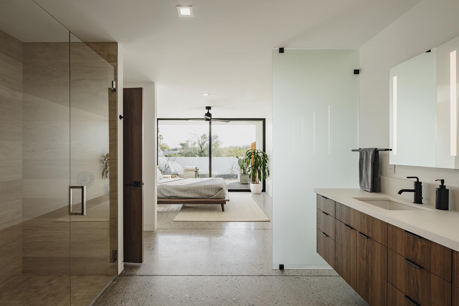 A modern bedroom that opens to the bathroom.