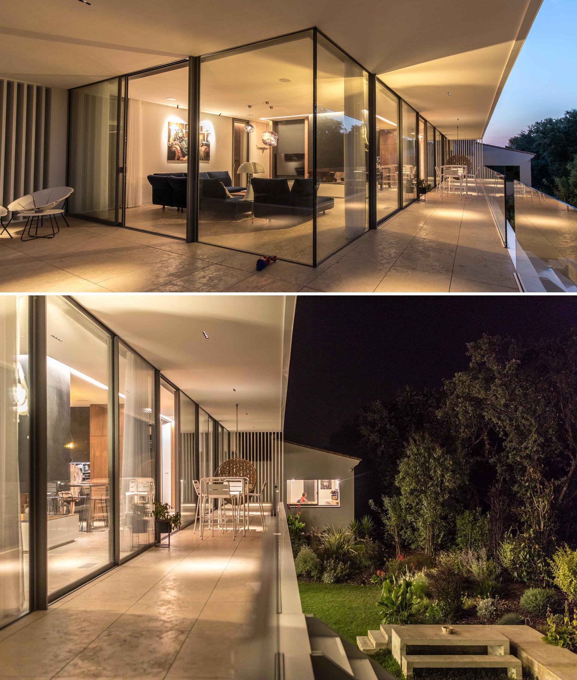 A modern house extension with glass walls and glass balcony railing.