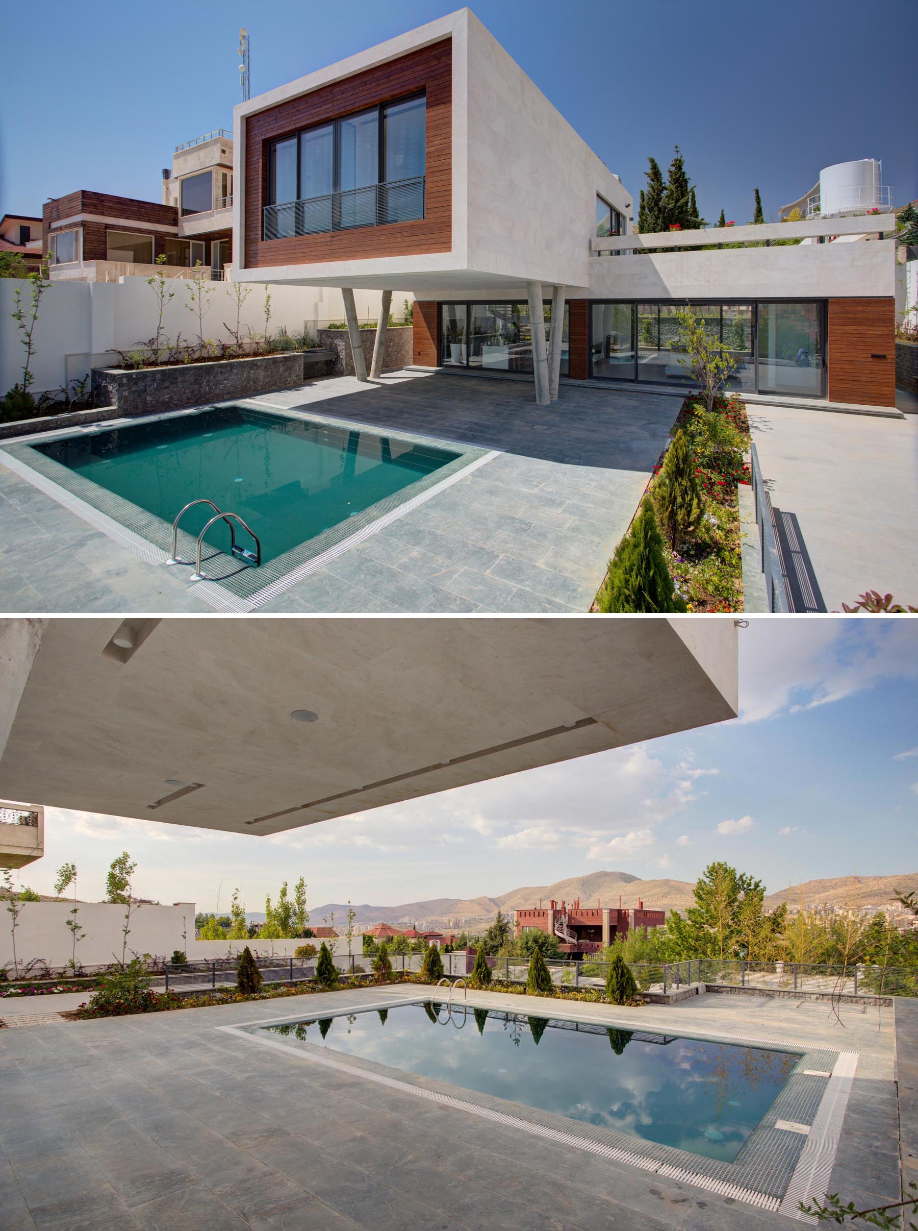 A swimming pool with a covered outdoor area and an outdoor kitchen.