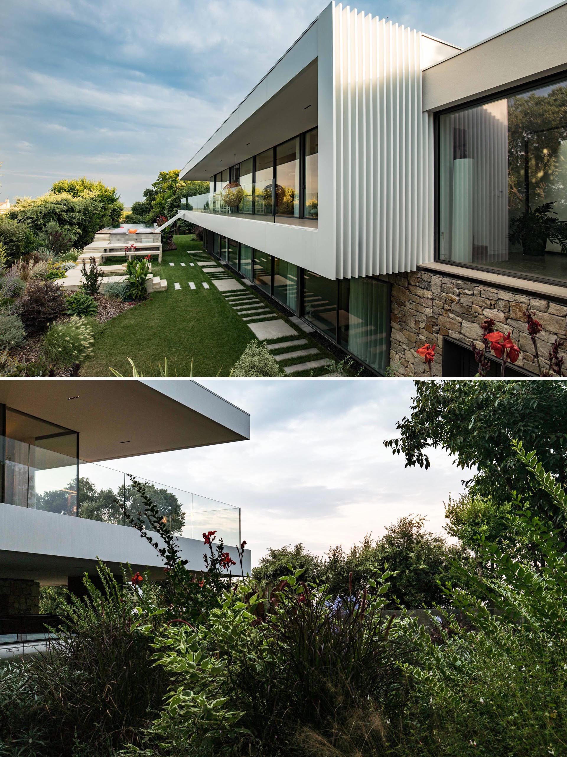 A concrete and steel house extension with glass walls.