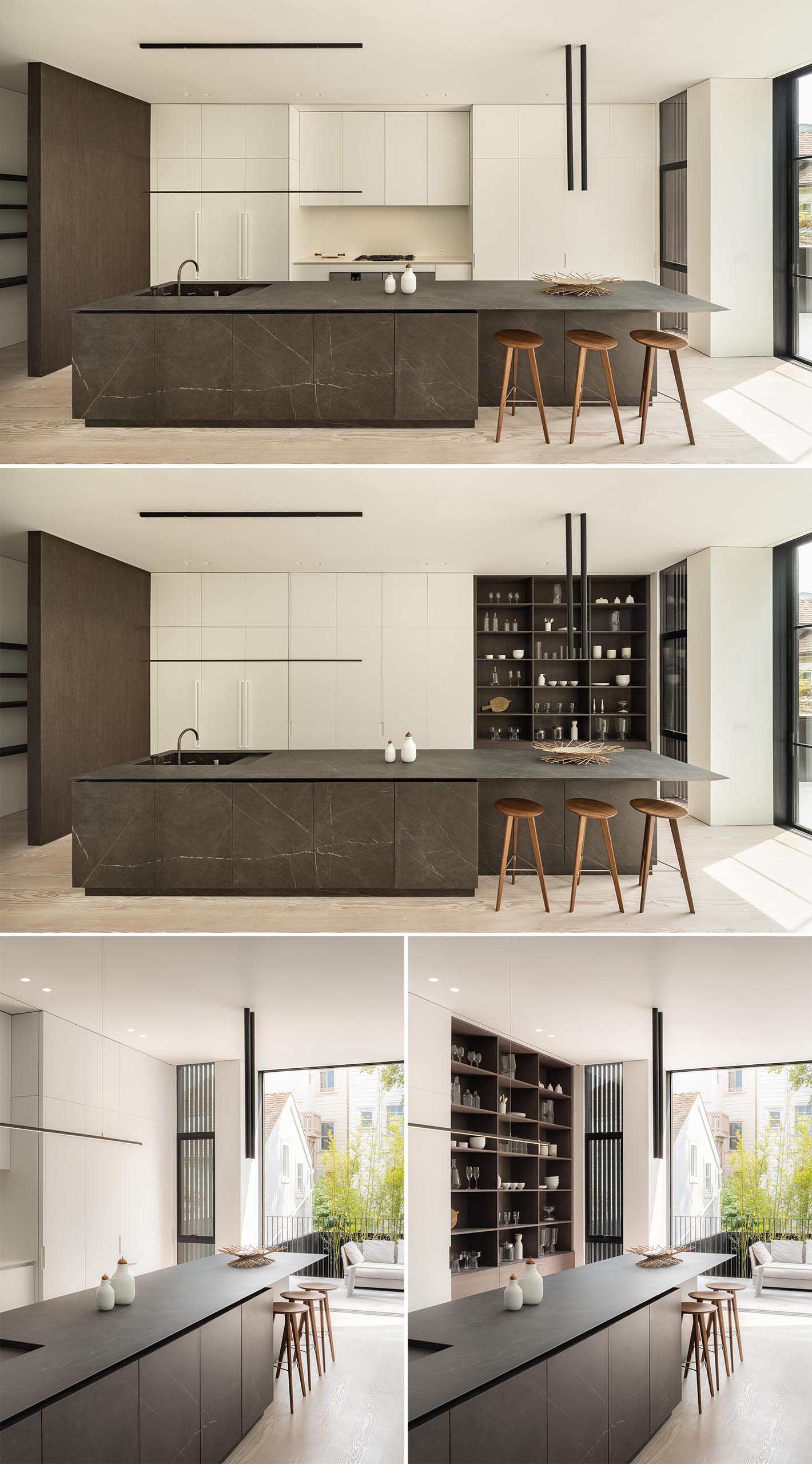 A white kitchen with a large island that provides contrast.