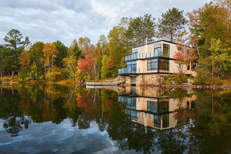 The 'Val-des-Monts Boathouse' Sits Prominently On The Shores Of A Canadian Lake