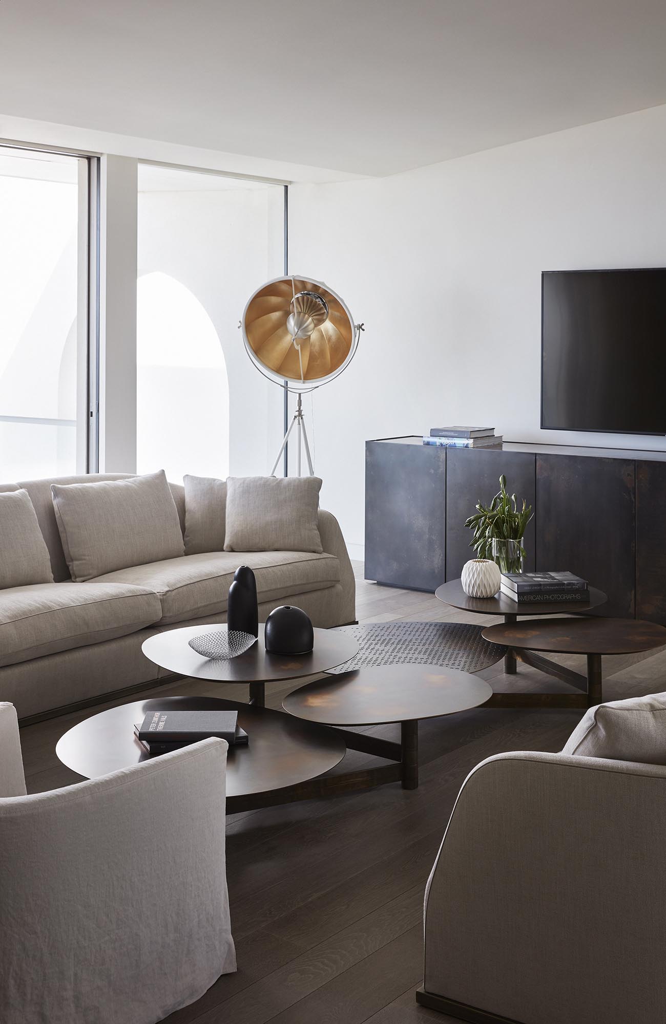 Modern living room with multi-height tables.