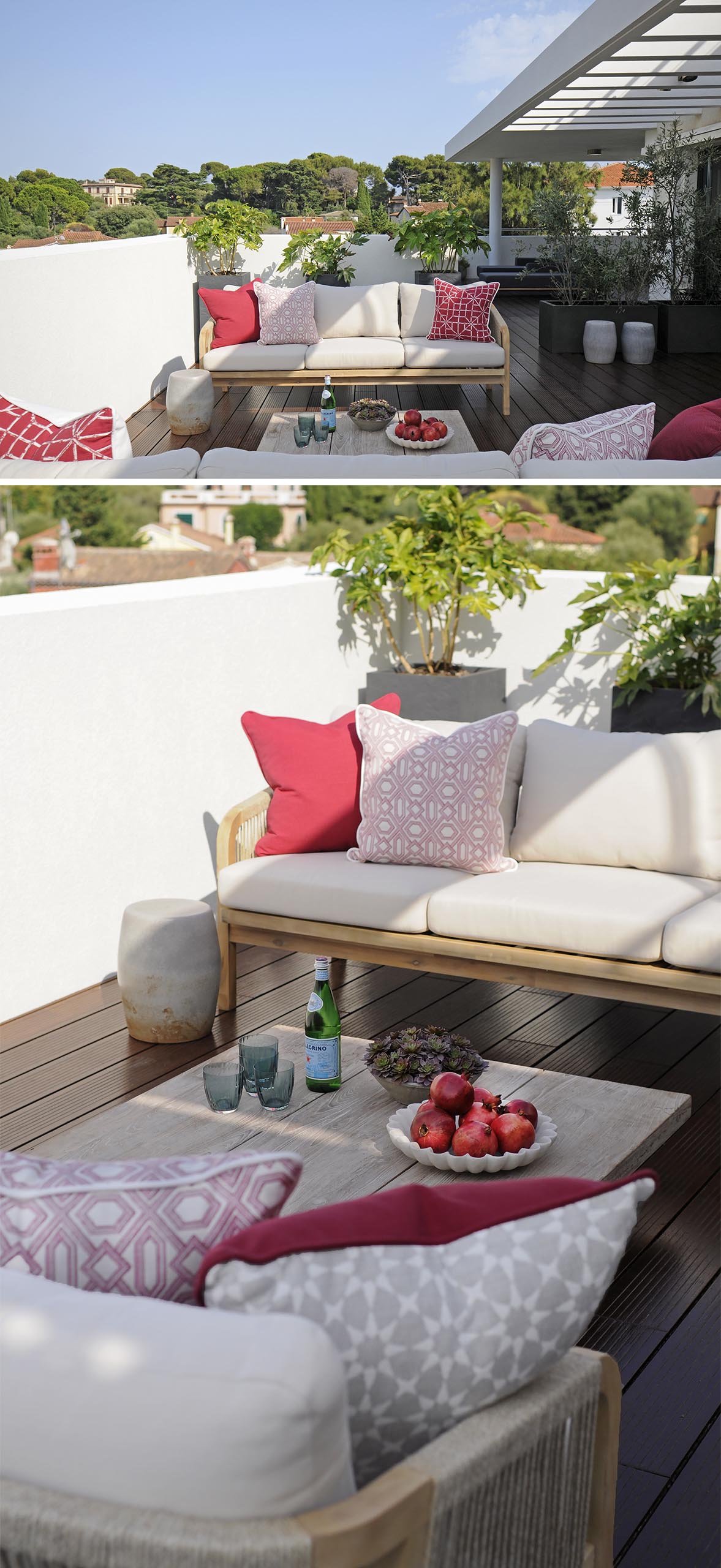 An outdoor terrace with sofas and red cushion accents.