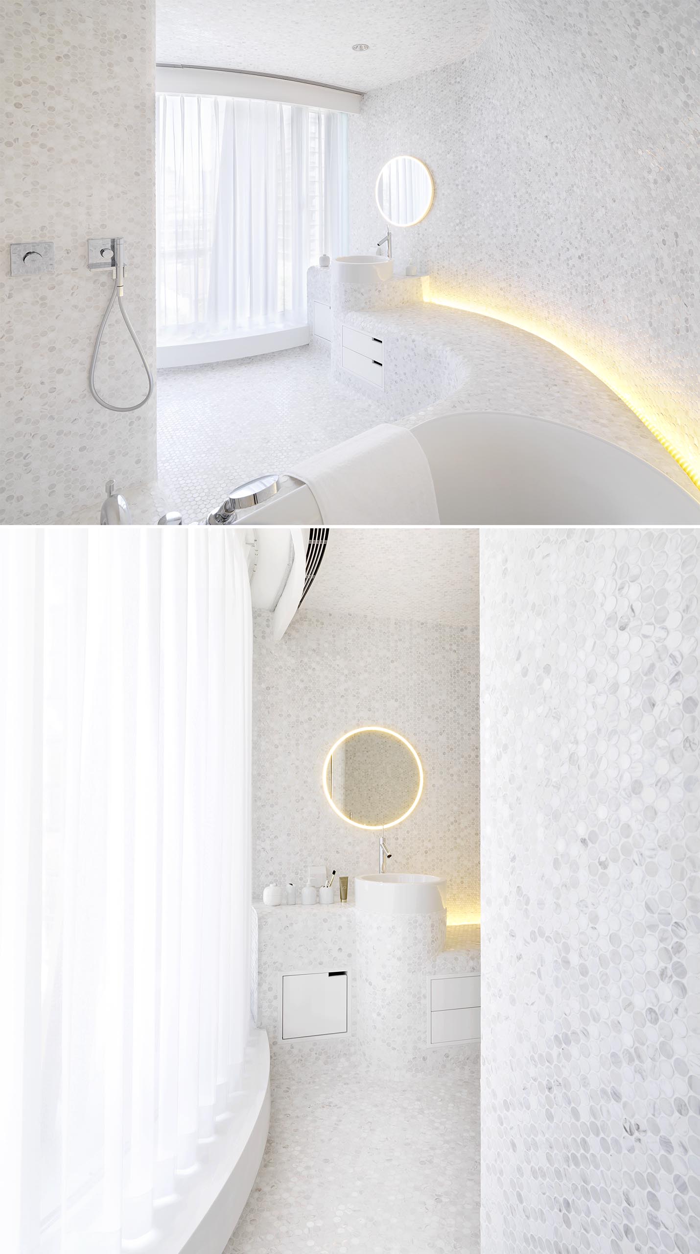 A modern white bathroom with penny tiles, hidden lighting, and curved built-in elements.
