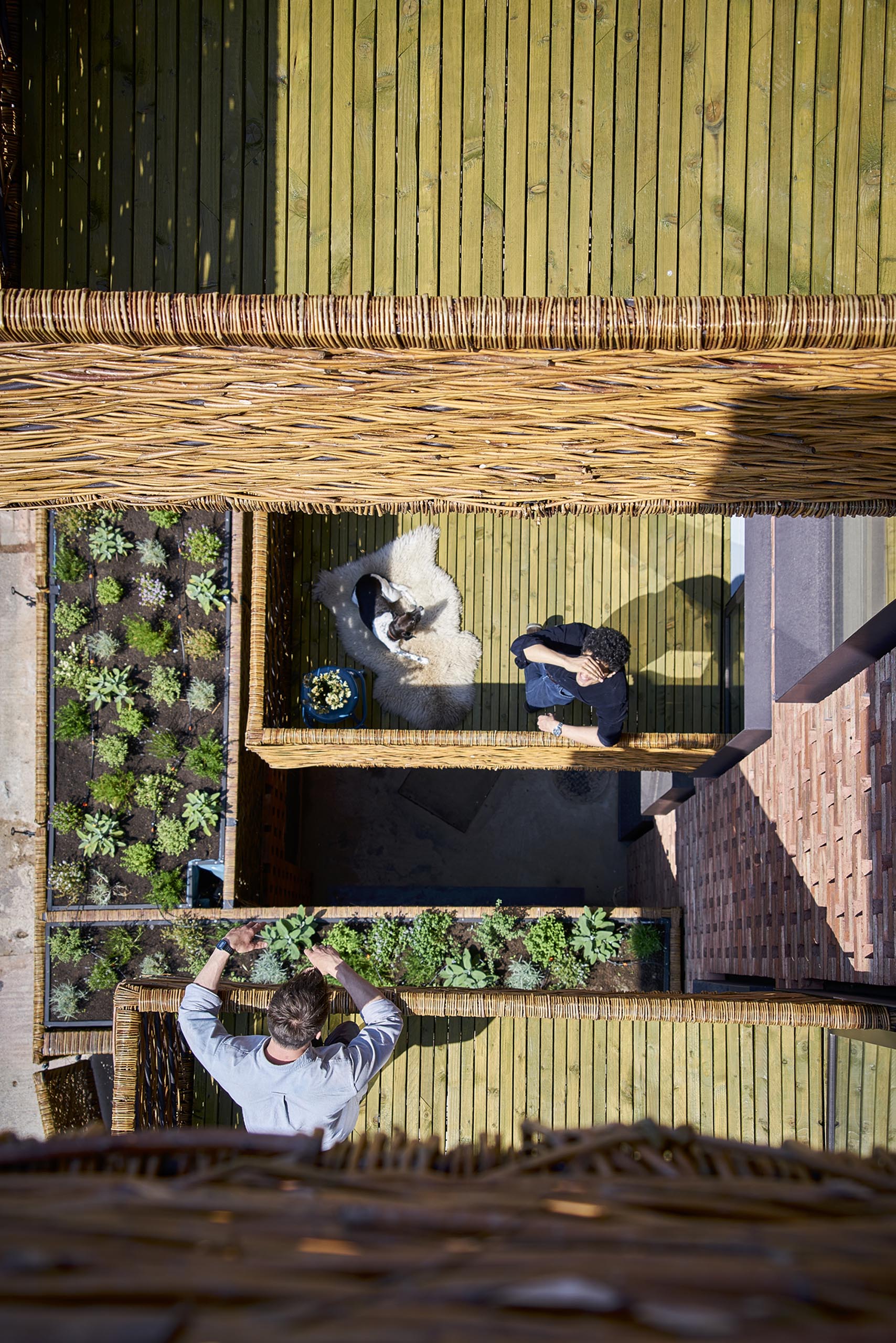 Woven wicker and wood balconies are designed for people to interact with each other.