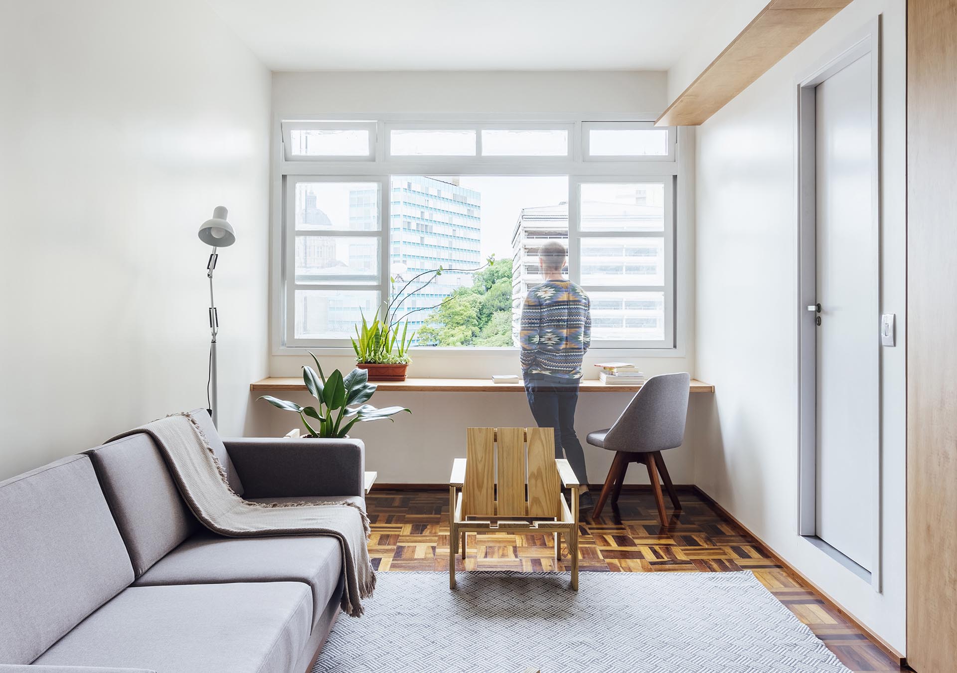 A simple wood desk has been added underneath the windows.