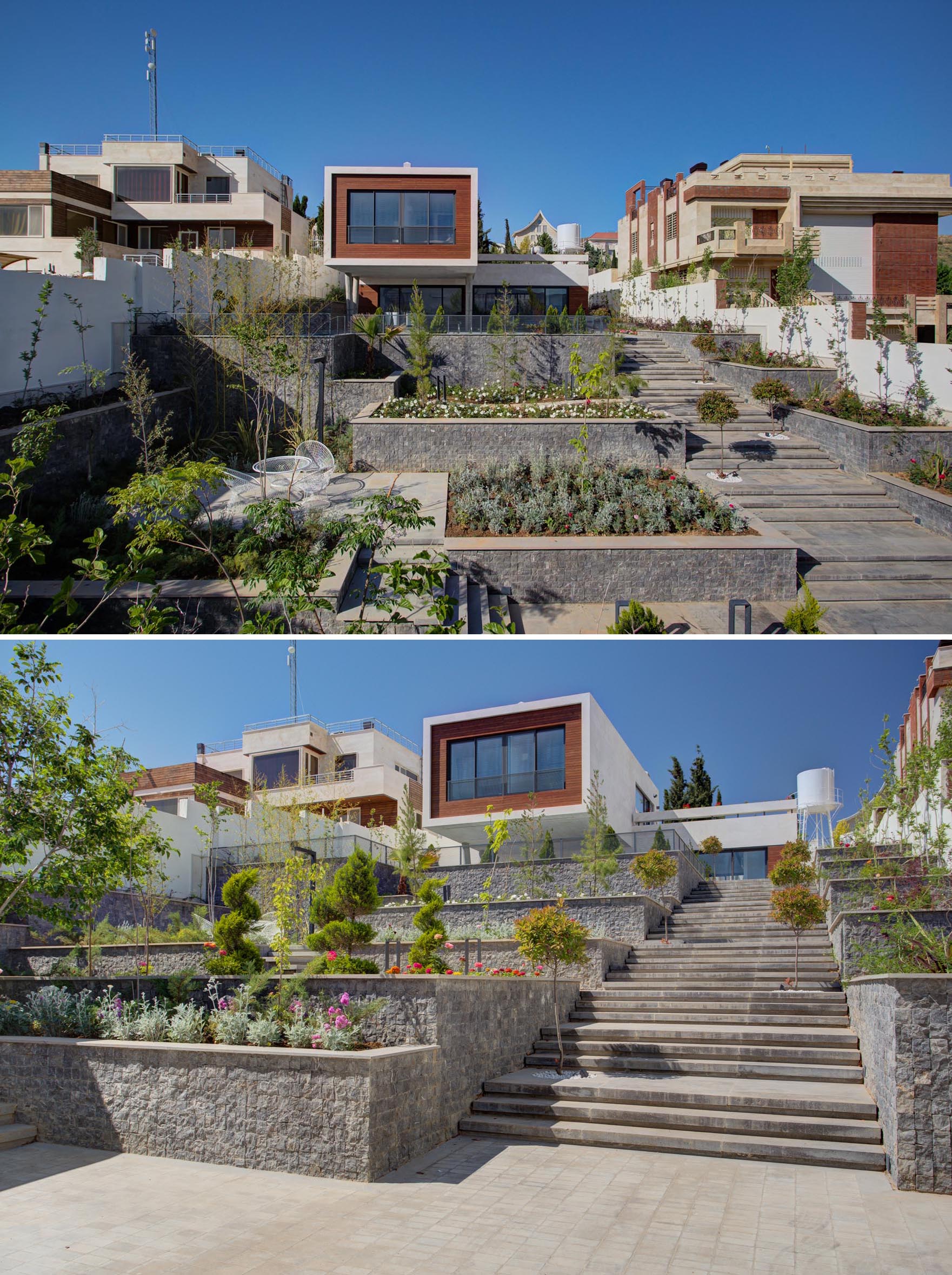A terraced yard with wide stairs, small gardens, and places for relaxing.