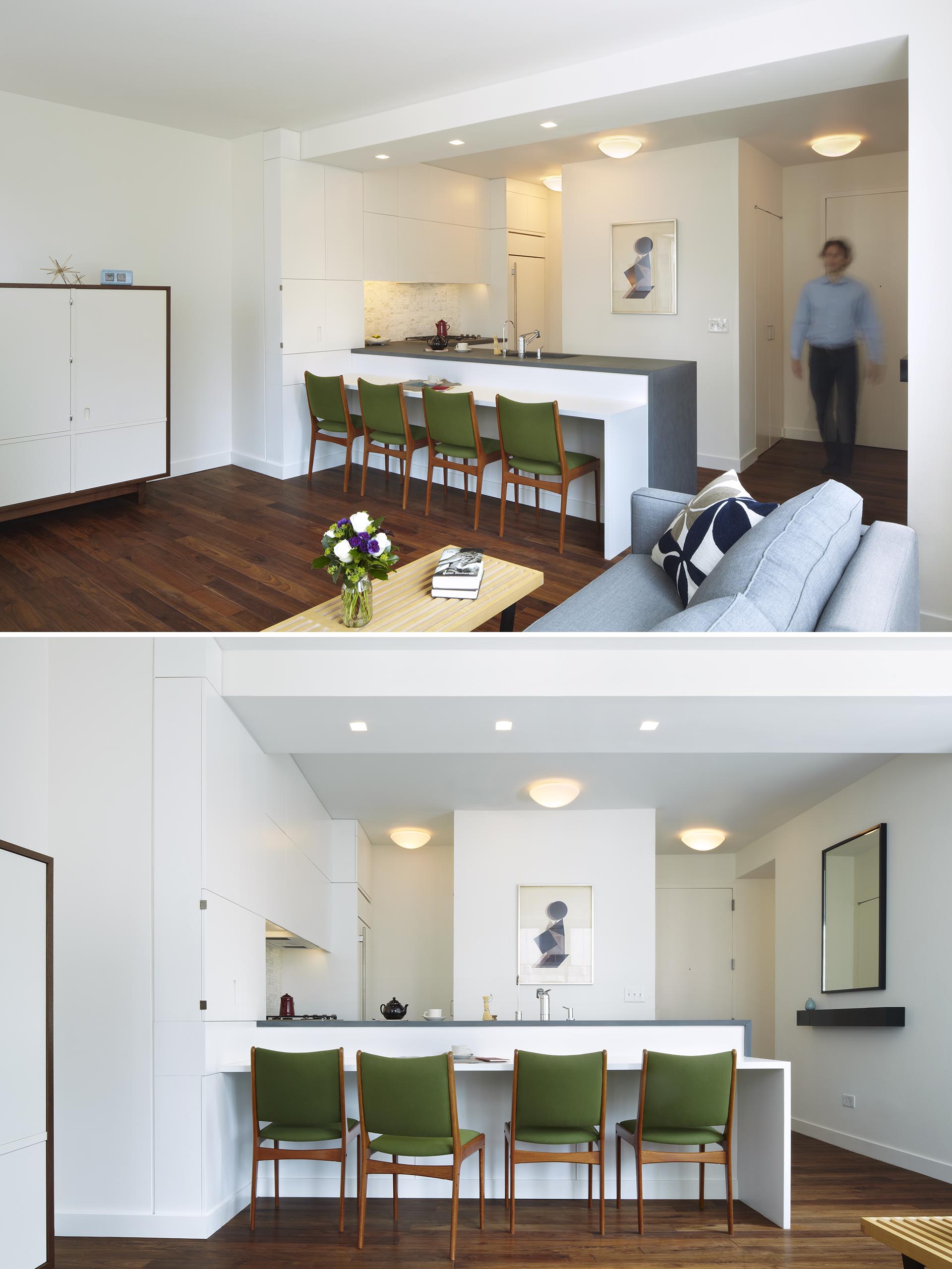 A modern kitchen with white cabinets and grey countertops.