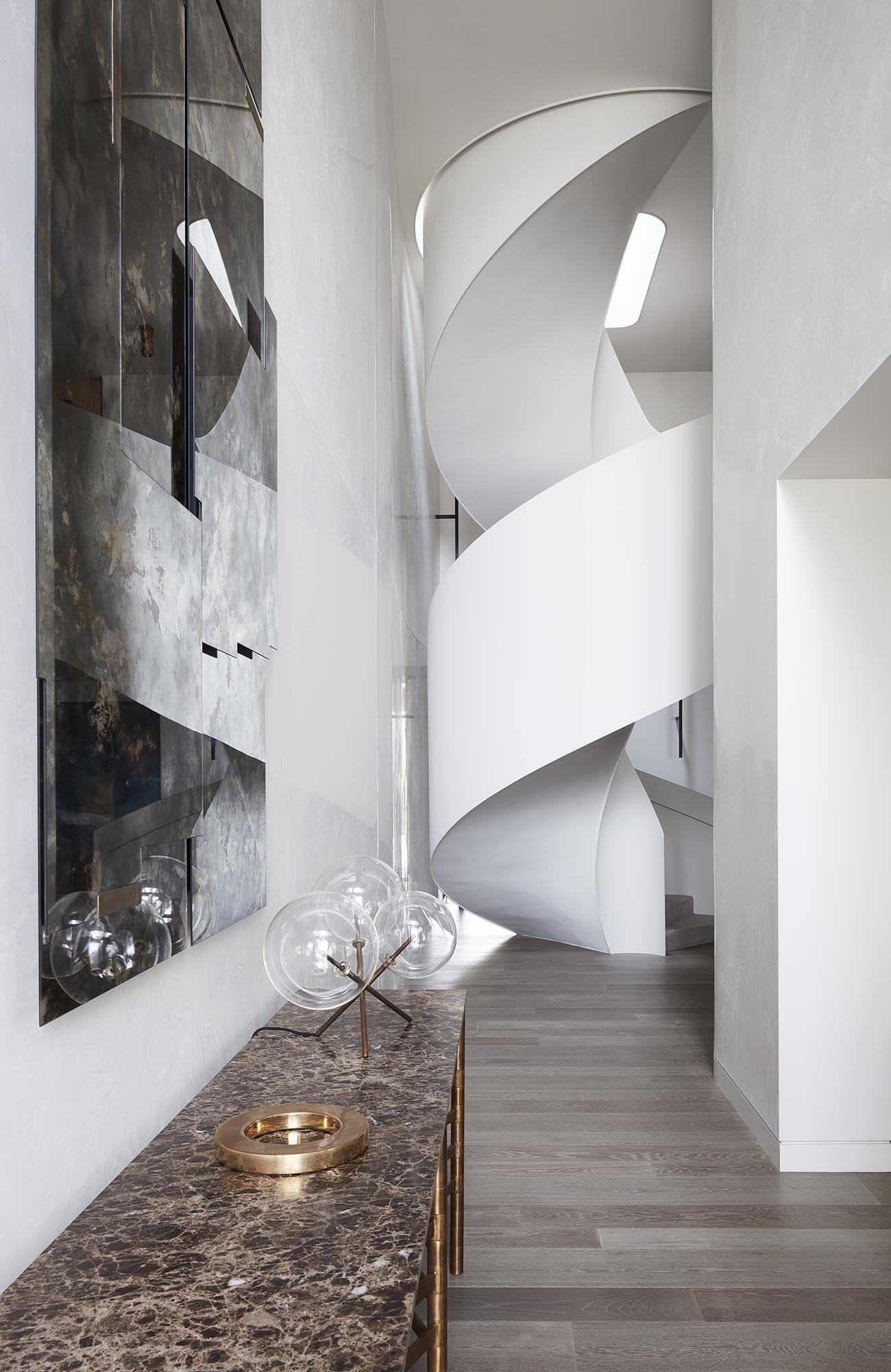 White spiral stairs in a modern interior.