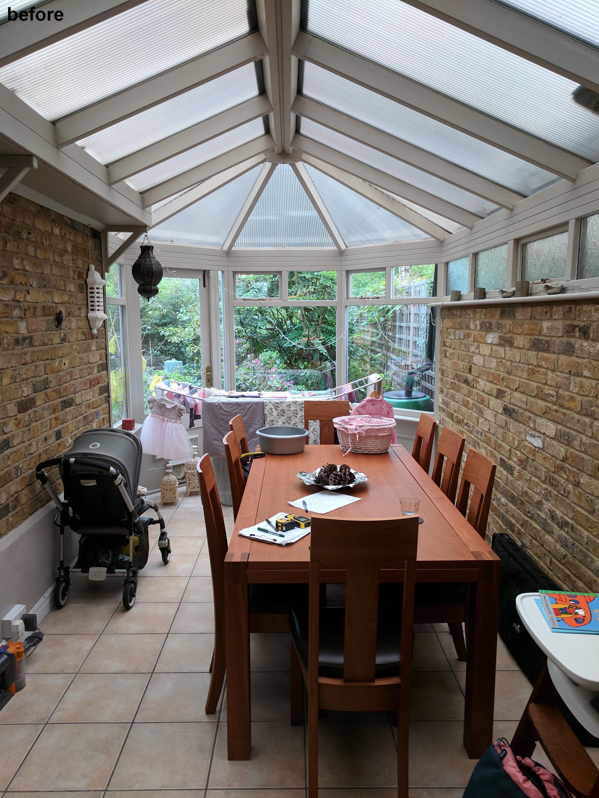 Before photo - a dining room with skylights.