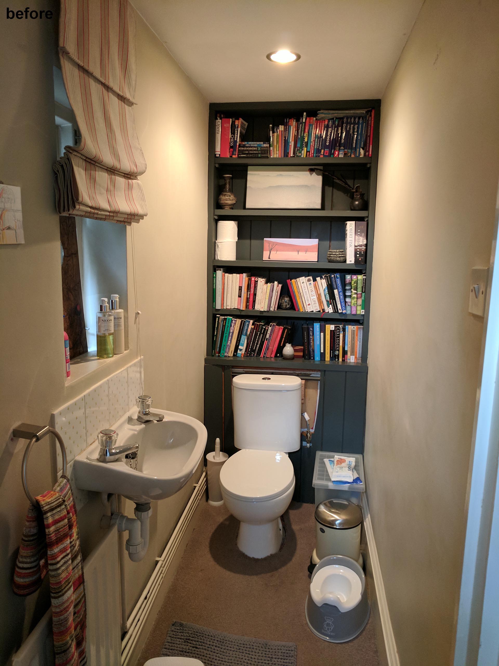 Before photo - A cluttered powder room.