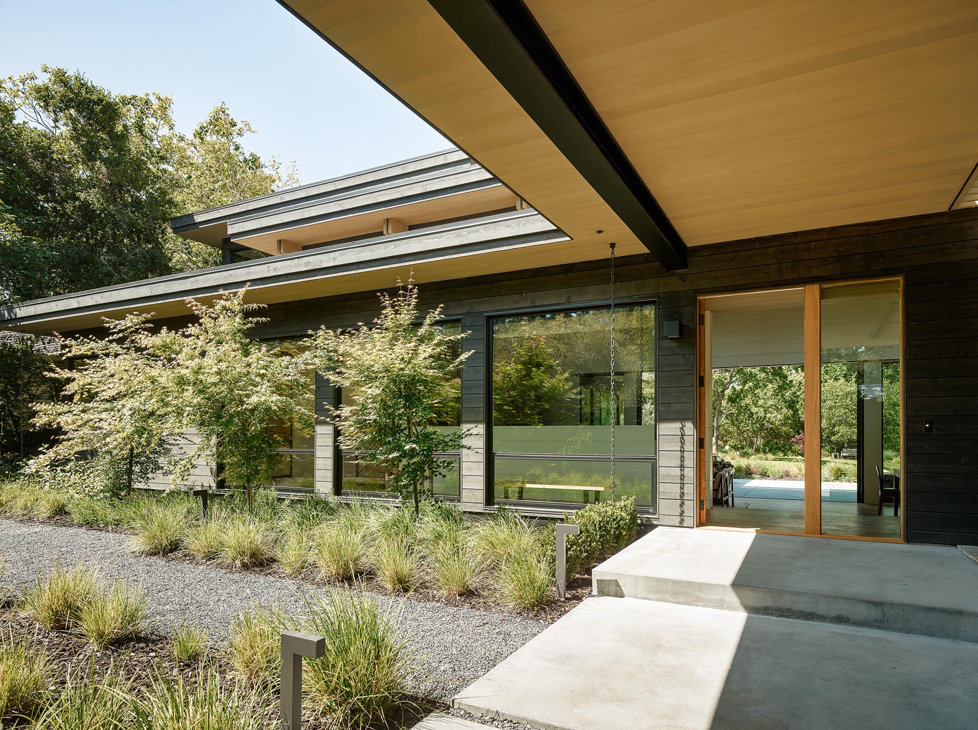 A house exterior with black-stained cedar siding.