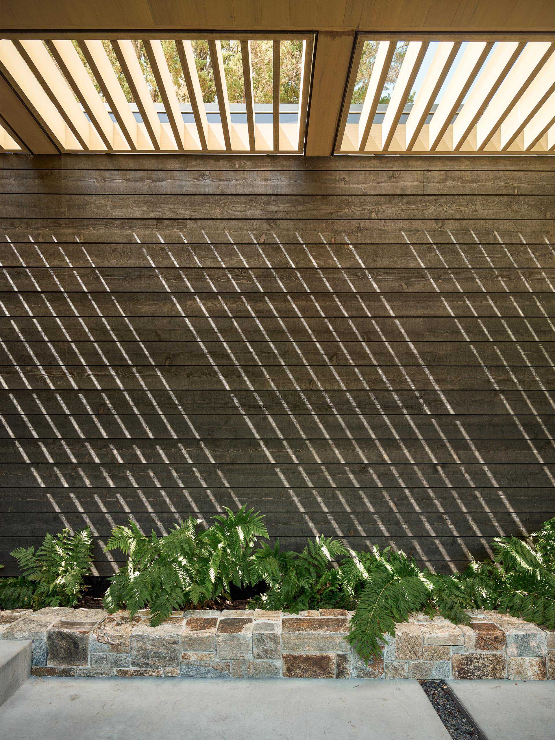 Black-stained cedar siding.