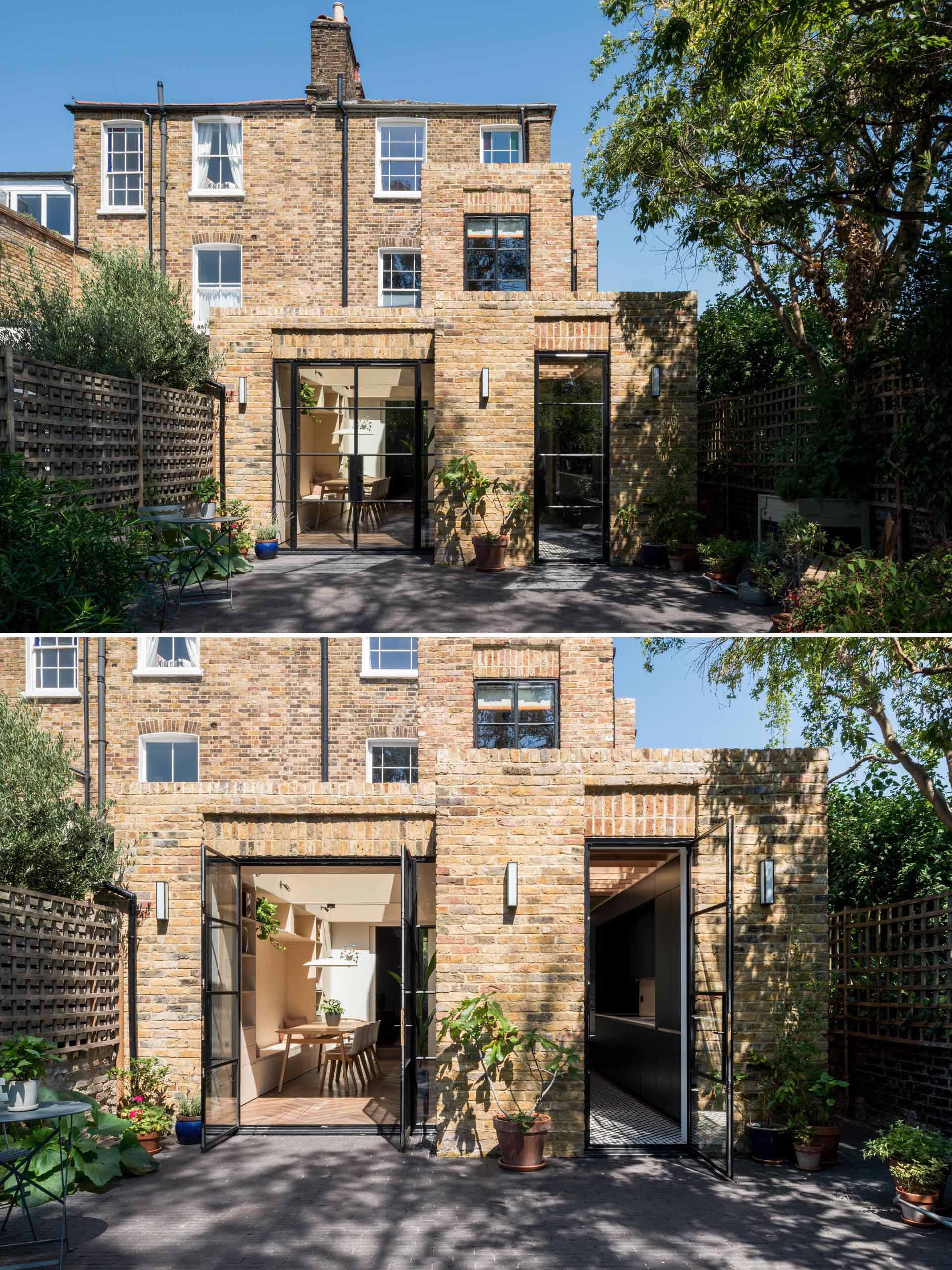 The new rear addition replaced the dated and disconnected spaces of this brick home, and created a single open floor plan that opens to the patio.