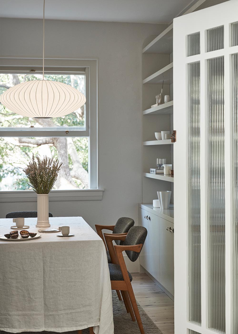 In this dining room, there's a focus on soft layering of textures, complementing the character of the apartment and the site’s natural bushland.