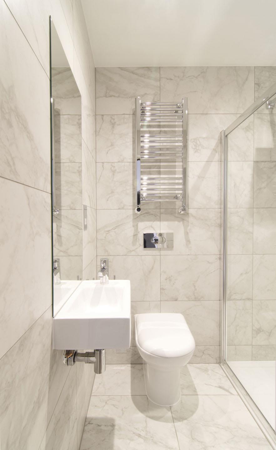 A small bathroom with walk-in shower.