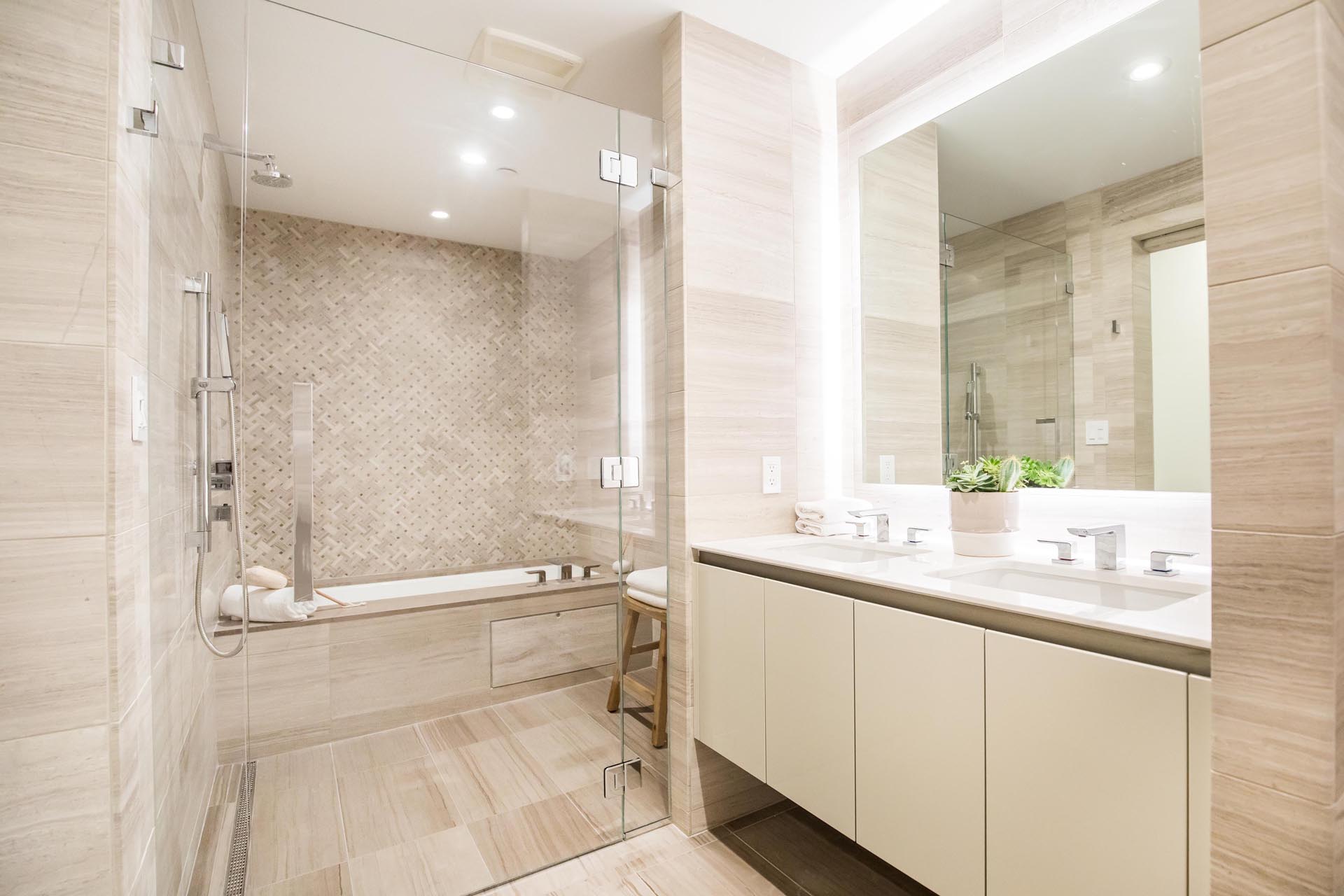 A modern bathroom with a neutral color palette.