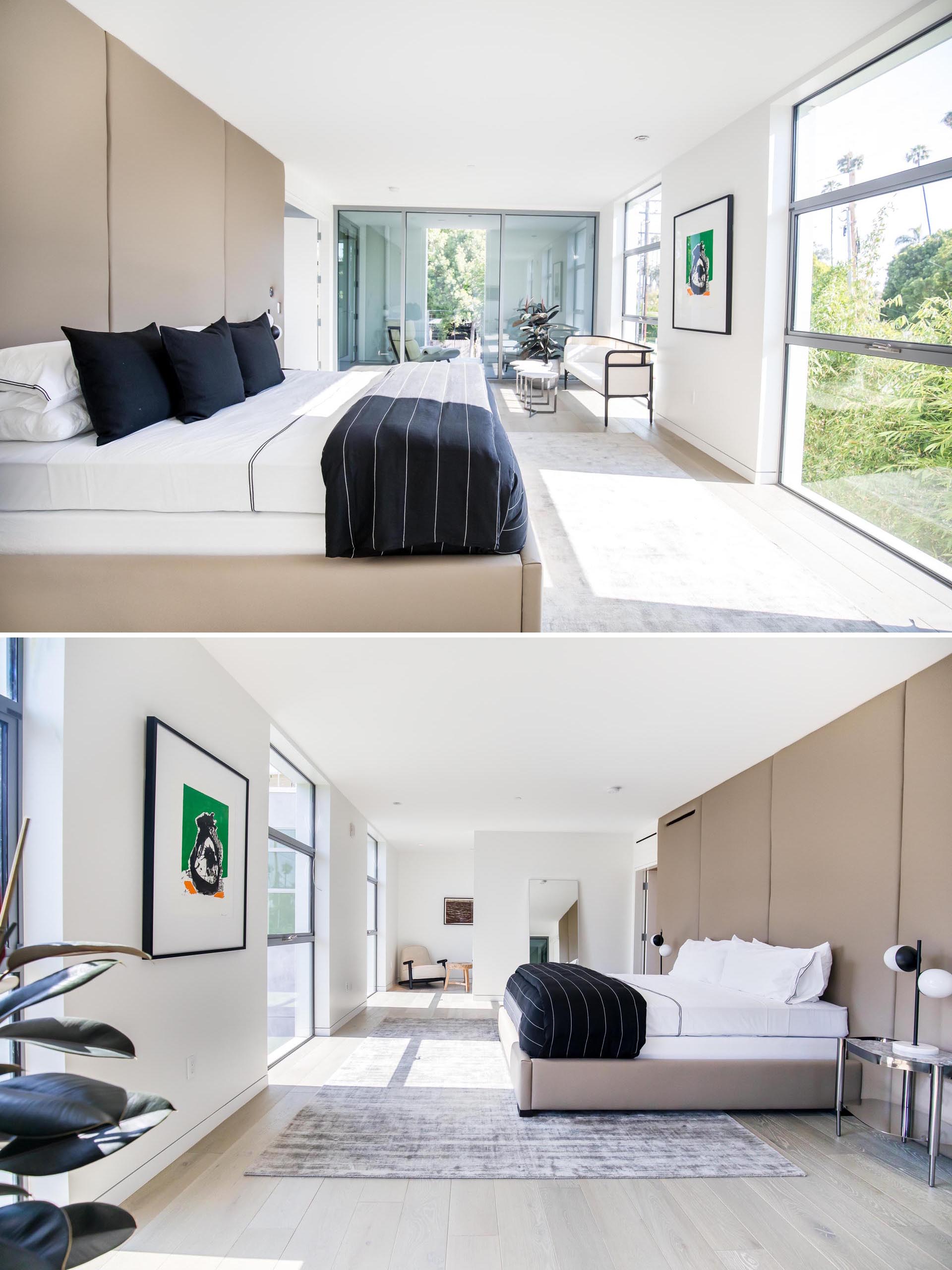 A modern master bedroom with minimal furnishings.