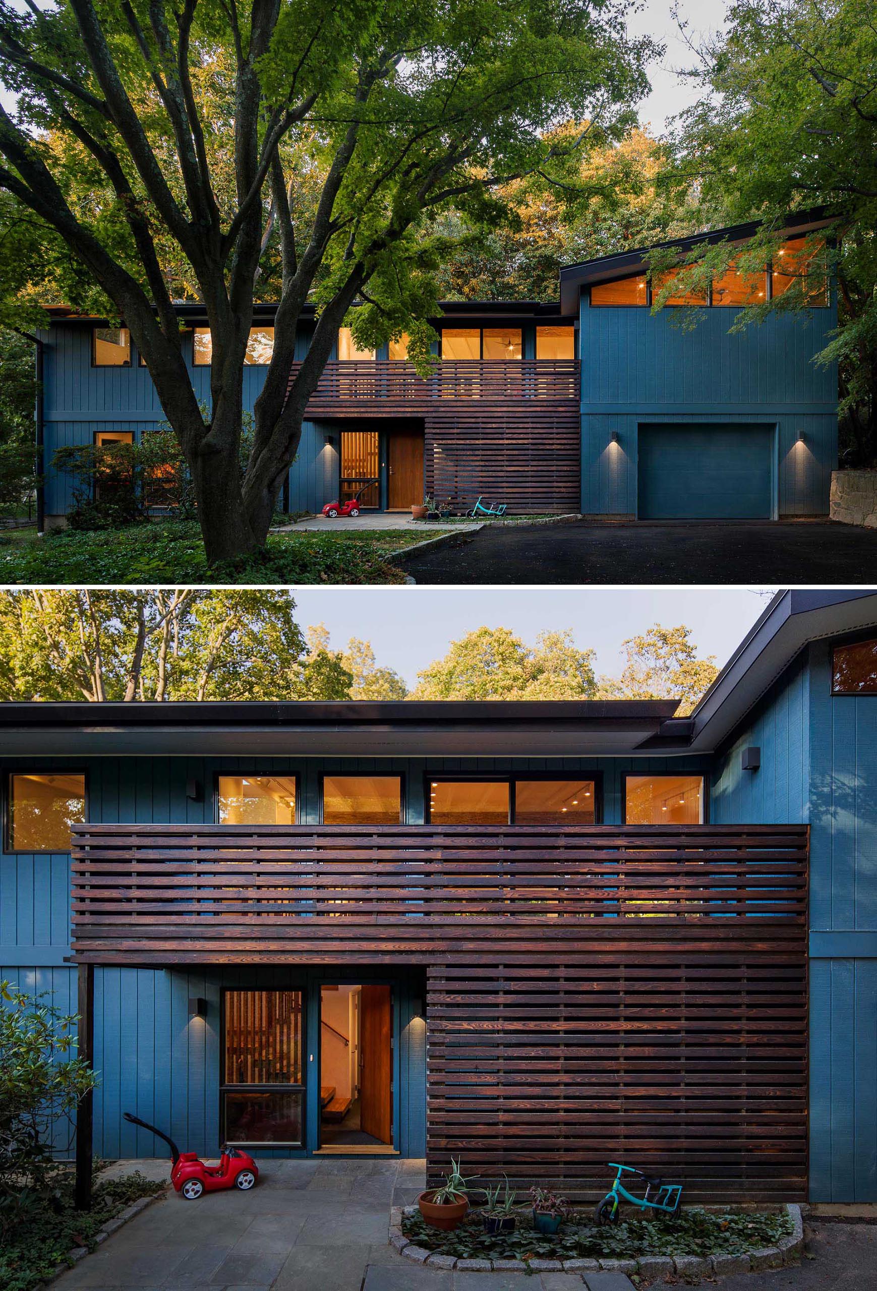 A home with a deep blue exterior and dark wood accent.