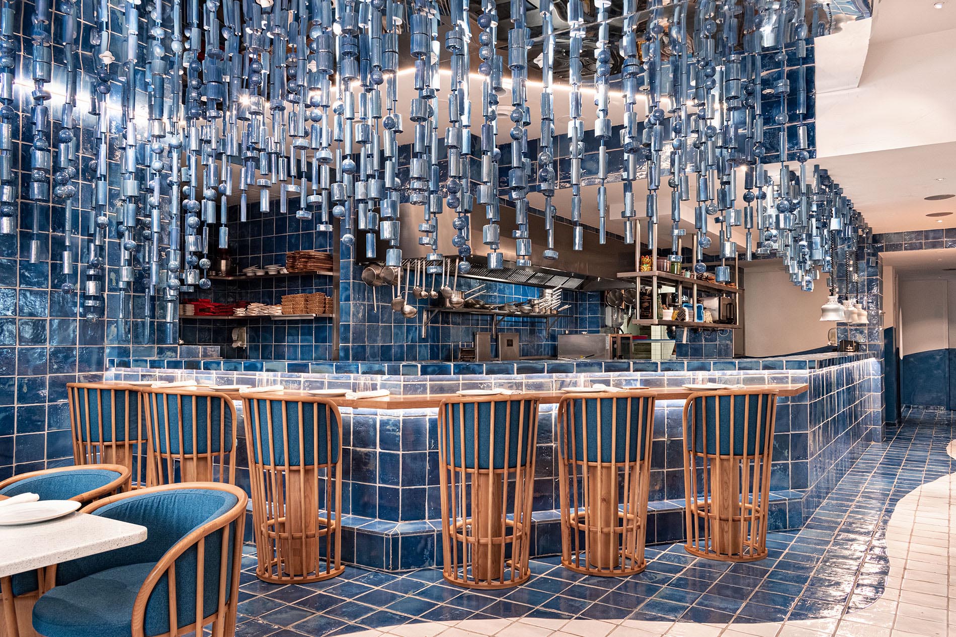 A modern blue restaurant interior inspired by a wave.