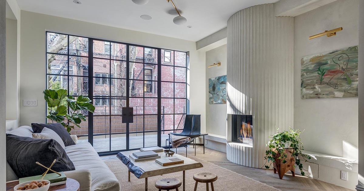 A Fluted Fireplace Surround Is A Central Feature In The Living Room Of This House In New York
