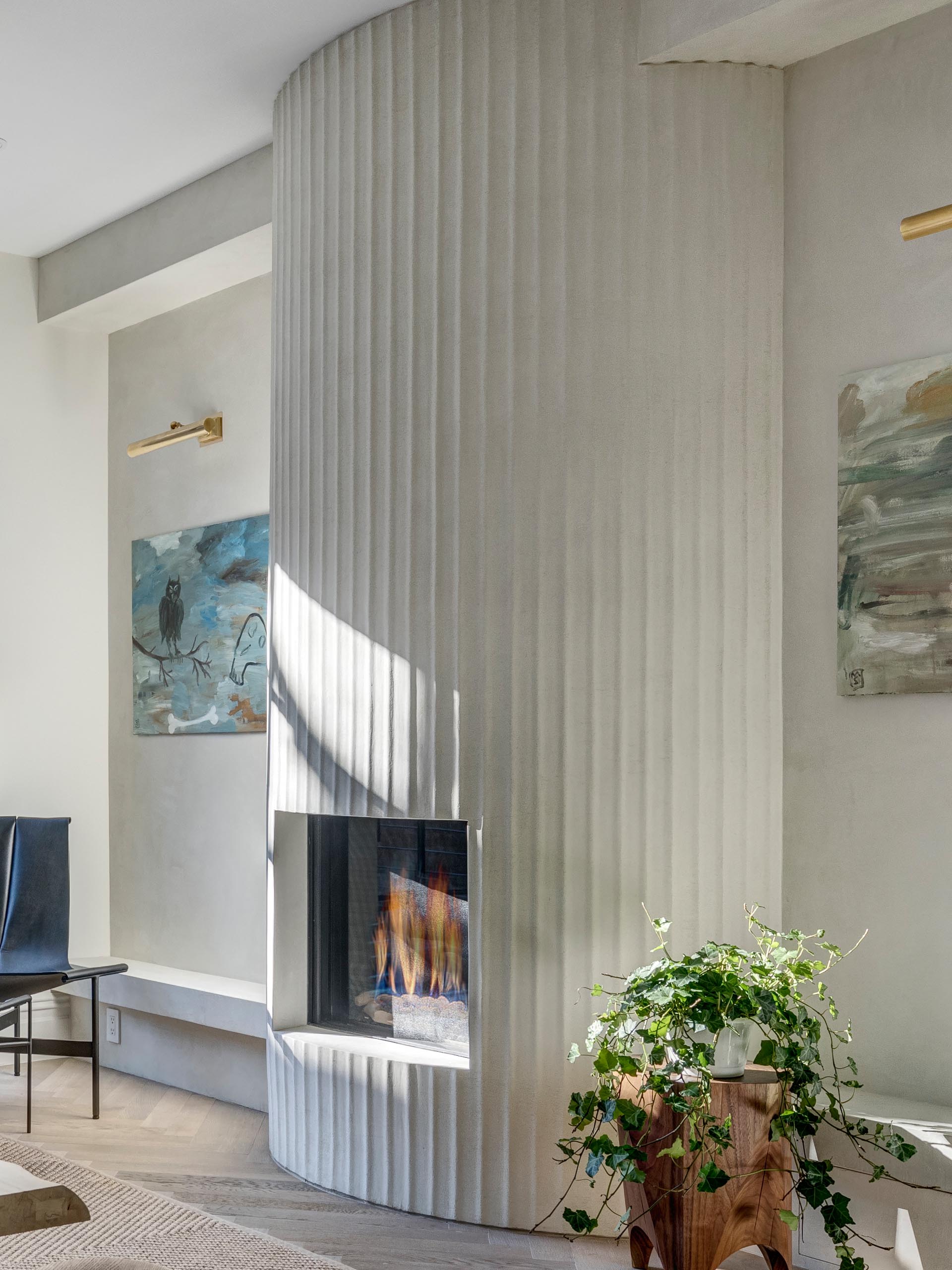 A modern fluted fireplace surround with a white finish.