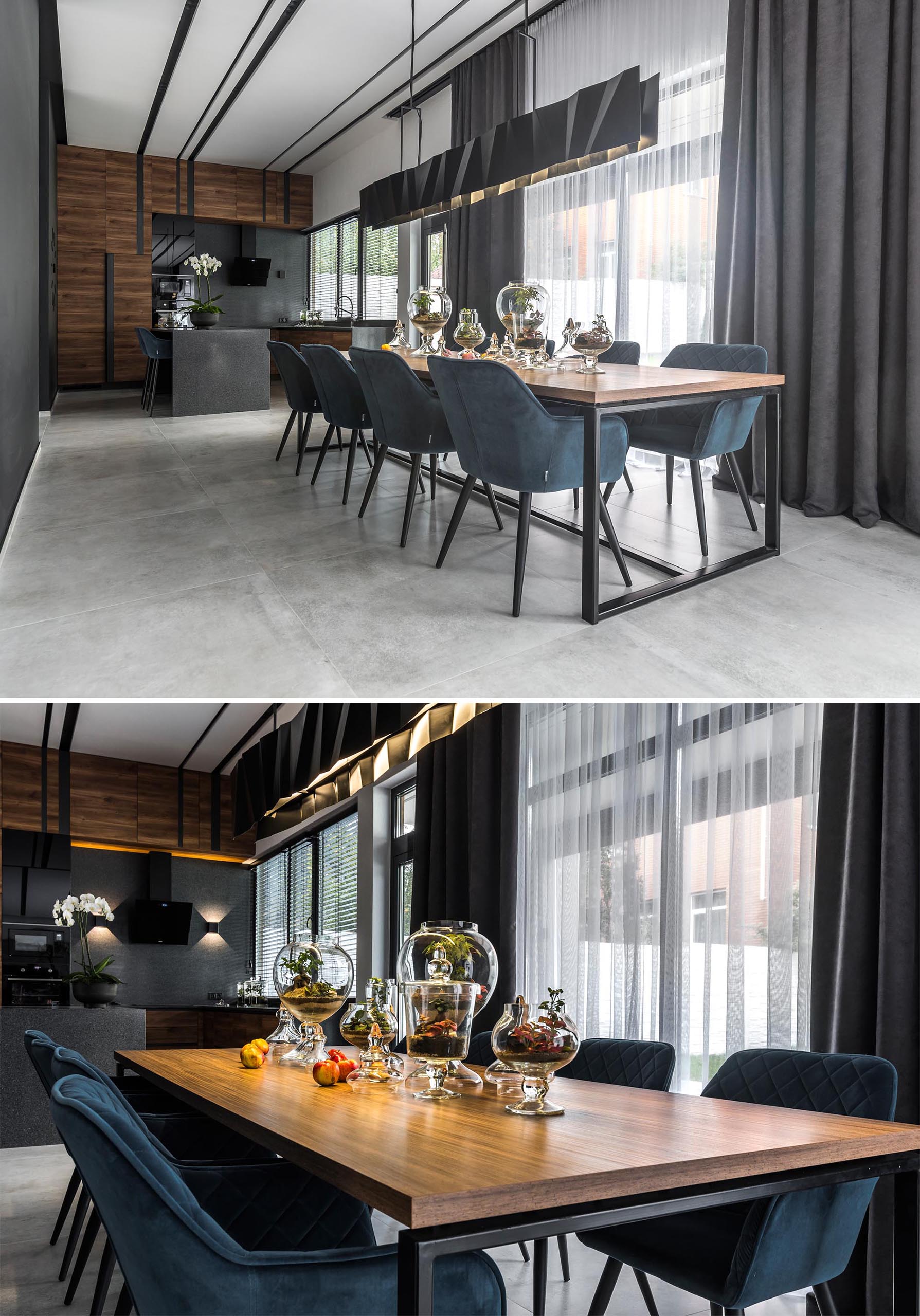 A modern dining room with a long matte black metal lighting fixture.