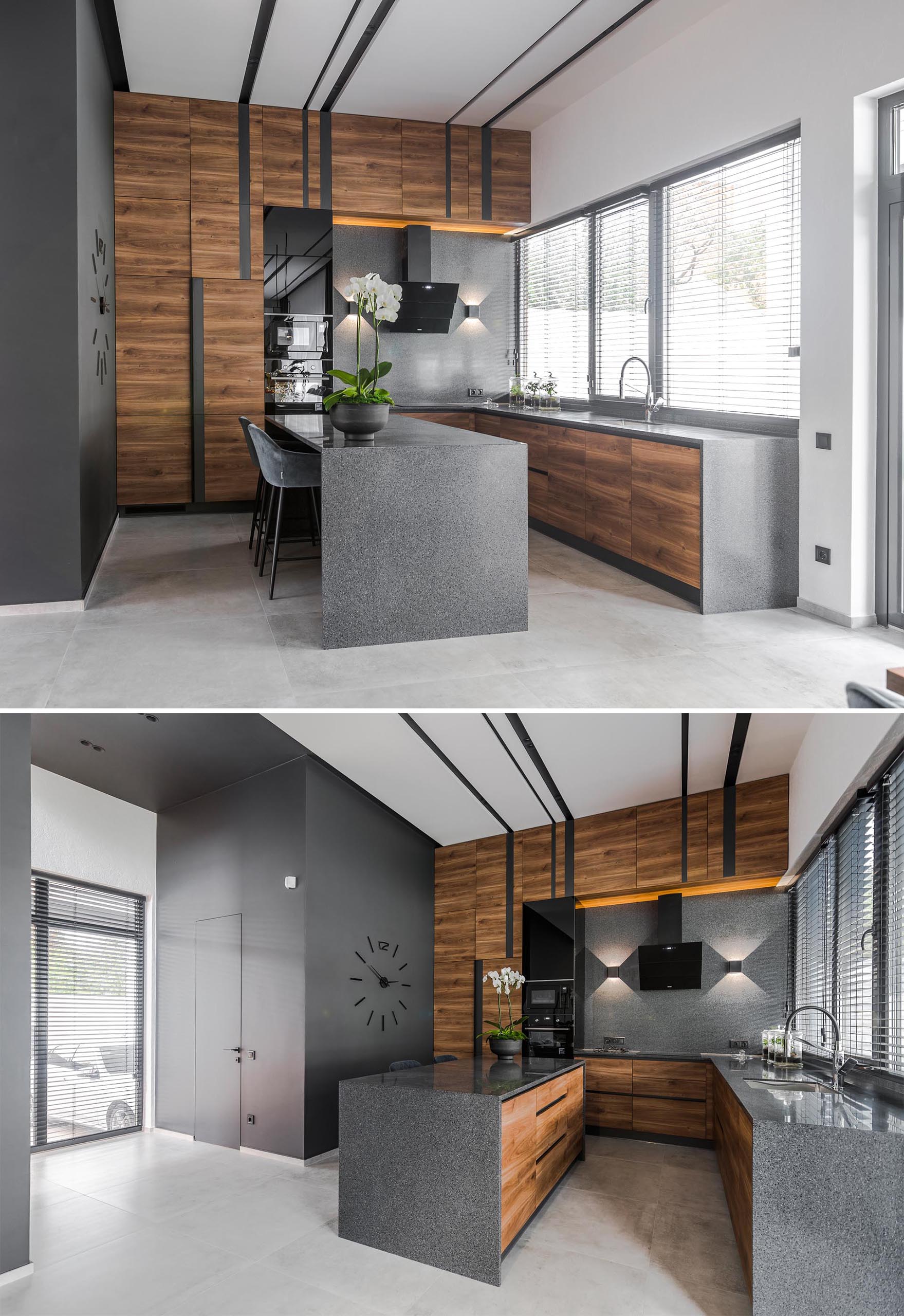A modern gray, black, and wood kitchen with island.