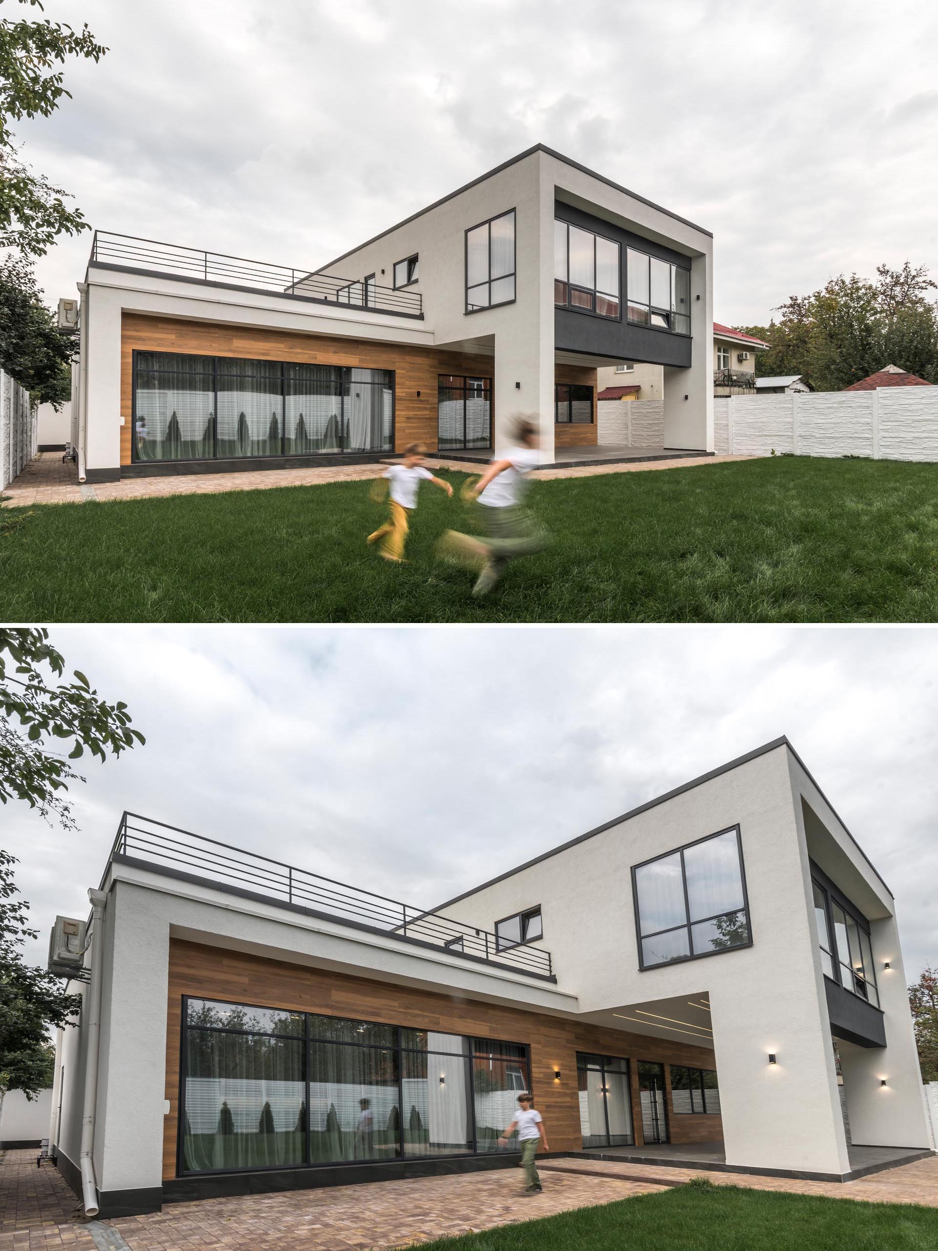 A modern home with wood-like tiles on the exterior.