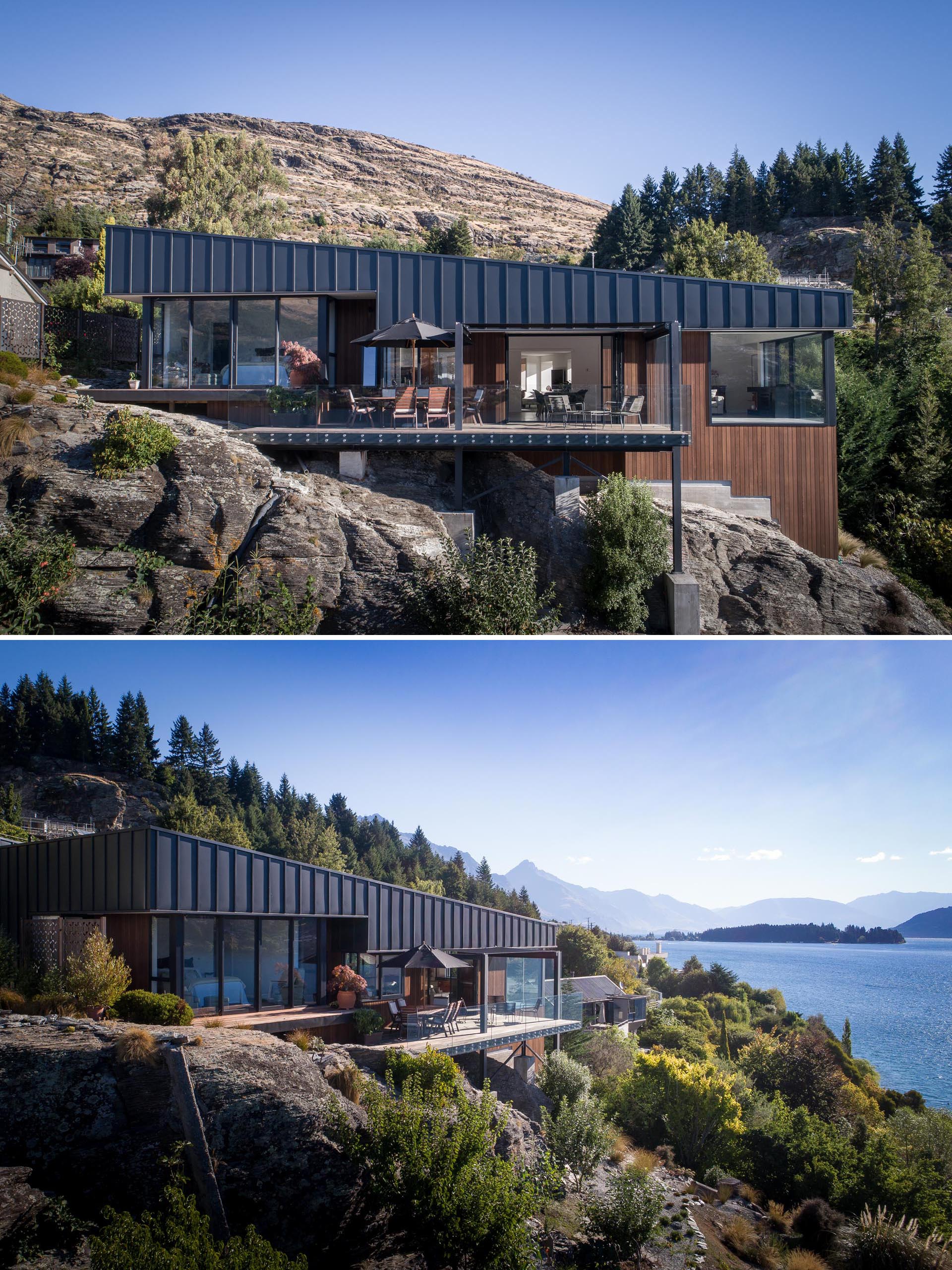 A modern house with matte black metal and wood siding.