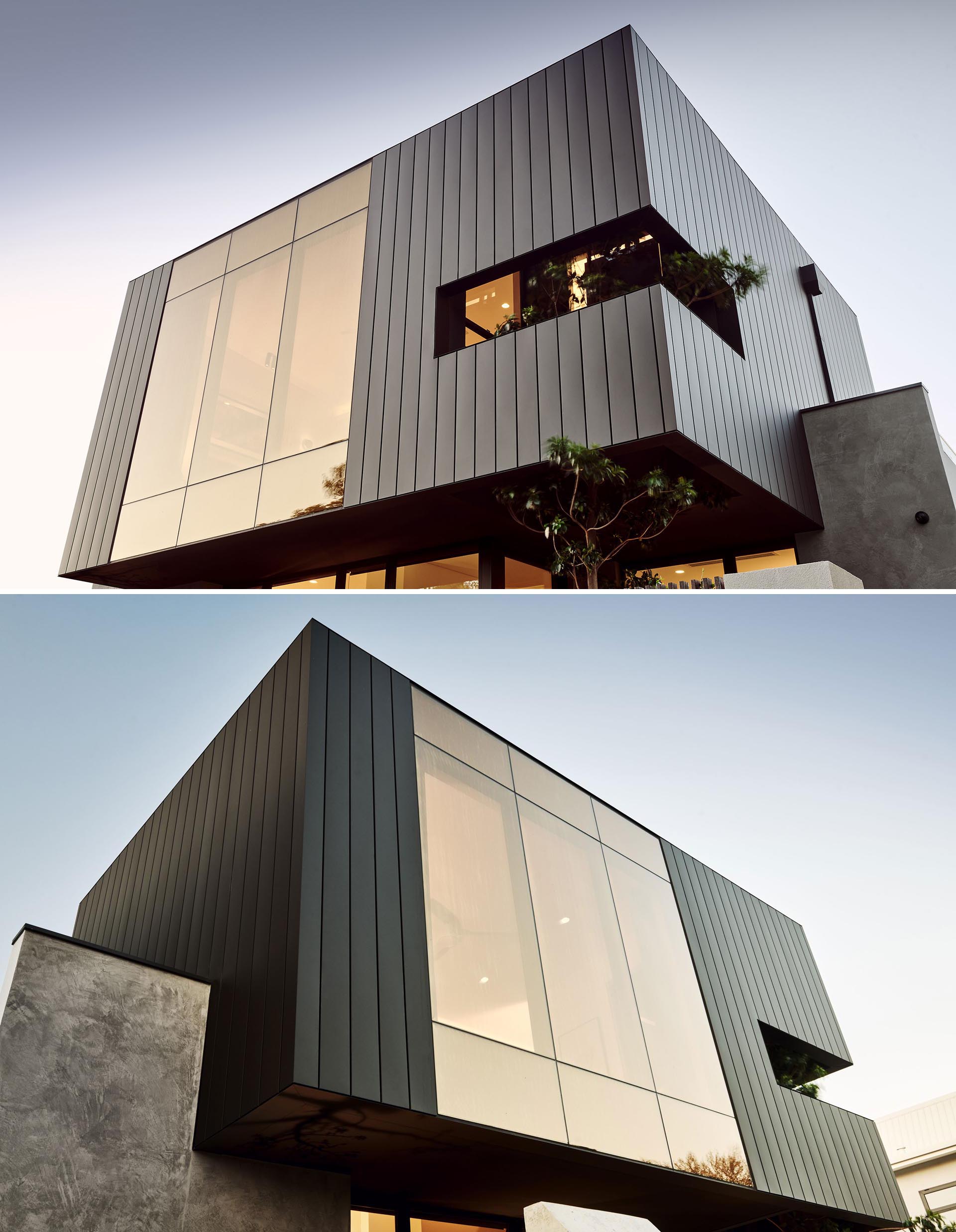 This modern home's facade features a superbronze, double glazed wall that's paired with matte siding.