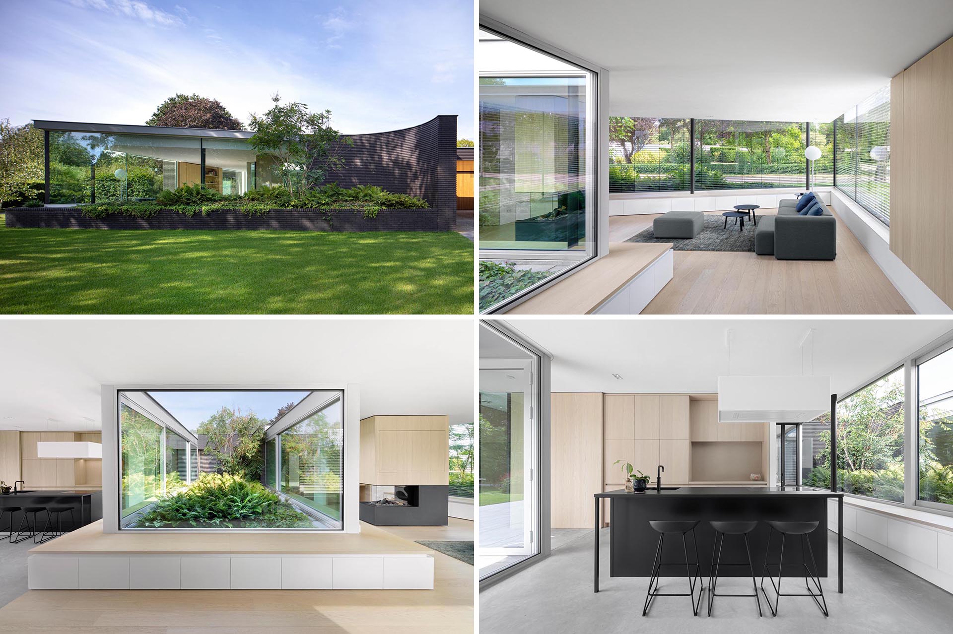 A black brick home with a bright interior, glass walls, and custom wood cabinetry.